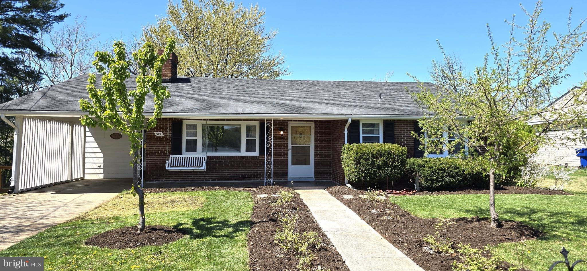 Beautiful brick ranch home in town, convenient location! You are going to love the sunlit rooms with gorgeous sunset and sunrise light! Enjoy both a covered front porch and a covered back patio with lush landscaping including berries, fruit trees, native plants, and more! INTERIOR: Extra large primary bedroom, original hardwood flooring, updated ceramic tile in kitchen & dining area. Gas stove. Fridge installed in 2019, microwave installed in 2023, garbage disposal, and water filter system at kitchen sink. Multi-purpose sunroom off kitchen. Could be used as an art studio, game room, or simply a place to relax! Bright living room with gas fireplace, picture window, crown molding, and built in shelving. BASEMENT: Large lower level rec room with wood stove, built in shelving, office space, potential 2nd kitchen with laundry, guest room, unique (industrial) full bathroom, utility room, storage closets, and walkout private door to backyard. Basement square footage is approximate. OUTDOOR FEATURES: Landscaping galore! Strawberries, blueberries, rose bush, juneberries, milkweed, and native flowers just to name a few! Property runs down to the creek in the backyard. Many types of birds love the yard and provide entertainment especially in the warm weather! 2 sheds in backyard are ready for gardening tools and hobbies. New roof installed in 2018. New heat pump installed in 2018. New sump pump installed in 2025. CONVEY: MEFlow membership can convey to new owners. PLEASE NOTE: This home can easily be a THREE BEDROOM home. Sellers will consider converting the large primary bedroom back to 2 bedrooms with solid offer. Previous owners removed a wall to create a large primary bedroom. There is also space in basement for additional guest room.