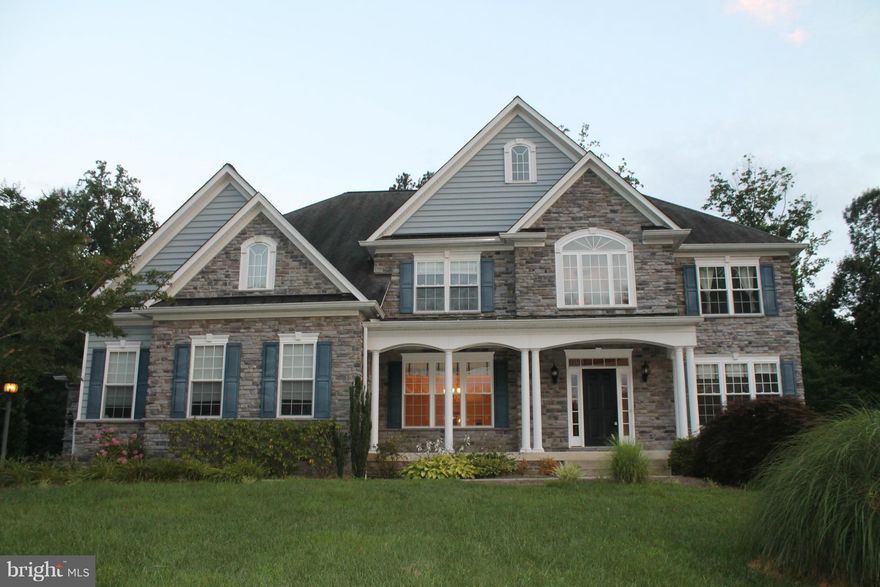 Gorgeous spacious home in the sought after neighborhood of Queensberry.  All the bells and whistles, central Vac, Gourmet Kitchen, In law bedroom on the main level, well kept deck, you name it, it is probably here.  2 car garage with a separate garage for another car, or what ever you may want to store.  SOLD AS IS!  Huge price correction!