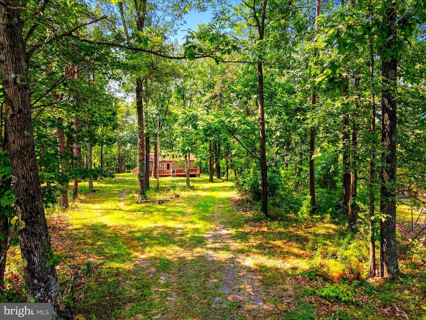 Breath taking views and solitude awaits!! Your very own cabin in the woods! Open floor plan featuring two bedrooms and one full bath! Front and back porch just waiting to be enjoyed! Surrounded by mature trees! This is a must-see!! Schedule your tour today!!