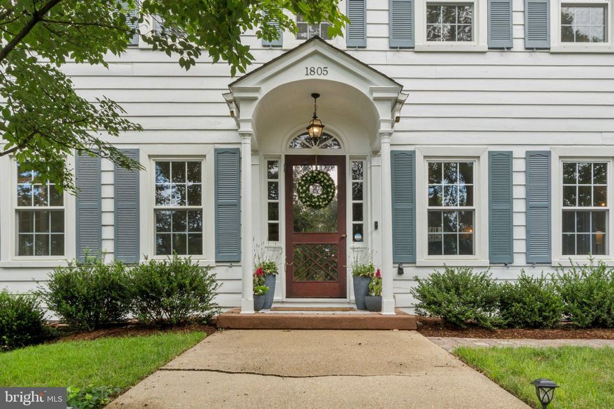 Discounted- $371k below assessed value! Rare double-lot—0.59 acre / 25,700 SF—in sought-after 22202! Classic 1932 Sears Colonial set back from the street sits on a combined .59 acre lot (two lots included, 25,700+ SF). The expansive 5 bedroom, 3 full and 2 half bathroom stately center-hall colonial features a finished attic and rec-level, and is not to be missed. An elegant staircase leads you to the front door and into a welcoming foyer, hardwood floors throughout the main and upper levels shine in natural light from the abundant and oversized windows on all sides. The main-level legal bedroom suite with its own full bathroom and private entrance is ideal for live-in support such as aging in place or guests, and exits onto a second stone patio. Very generous proportioned rooms in this home, starting with the formal dining room and then enter the first living room through classic French doors. From the living room you can either enter into the park-like backyard or the open-concept kitchen, both of which are spacious for easy every-day life and entertaining. Kitchen boasts abundant white cabinetry, stainless steel appliances, granite countertops, a main-level half bathroom, and a second door that leads to the rear stone patio and deck. Upper level features three spacious bedrooms, two full bathrooms, stairs for the attic access, and an incredible owners suite. Owners suite is grand, boasting large windows, plenty of space for a king-sized bed and an additional sitting area, including three separate closets, one of which is walk-in, as well as an en-suite bathroom. Second and third bedrooms feature abundant closet space, loads of natural light, and share a hall bathroom with a large vanity. Upstairs in the loft, the finished attic includes a large bedroom and dedicated office with built-ins—and still leaves unfinished space for future expansion. Lower level has a large rec room, wet-bar, laundry/utility room, workshop, and an oversized two-car garage. Beautiful backyard features a large deck with seating, two stone patios, mature landscaping, and abundant grass. Supreme location—zero stoplights to Washington D.C.; walkable to the bus stop/metro and schools; and close to shopping, dining, and grocery stores. Easy access to the Pentagon, Amazon’s new National Landing HQ2 Headquarters, Virginia Tech Innovation Campus, and so, so much more! Live comfortably now, expand later, or explore redevelopment potential of the two deeded lots!