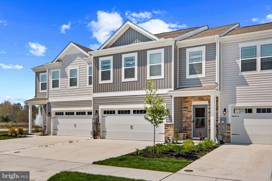 Discover the perfect blend of comfort, style, and coastal charm at 23558 Bonfire Way, ideally situated in the highly sought-after community of Millville by the Sea. This beautifully appointed 4-bedroom, 2.5-bath residence showcases an inviting open-concept floor plan filled with natural light—designed for both relaxed everyday living and effortless entertaining.

The thoughtfully designed kitchen serves as the heart of the home, featuring granite countertops, stainless steel appliances, a spacious walk-in pantry, and an expansive center island that flows seamlessly into the dining and family areas—creating an ideal setting for gathering with family and friends.

Upstairs, the generously sized primary suite offers a private retreat complete with a walk-in closet and a well-appointed ensuite bath. Three additional bedrooms and a full hall bath provide comfortable accommodations for guests or family, while the flexible layout easily adapts to a variety of lifestyles. Exceptional storage is found throughout, with more than ample closet space on both the main and upper levels.

This home is enhanced with numerous upgrades that would typically be additional costs in new construction, including custom interior paint, six ceiling fans, a new storm door, a paver patio, and a frameless glass shower door—adding both value and sophistication.

Step outside to the rear patio, perfect for morning coffee, outdoor dining, or unwinding after a day at the beach. A two-car garage adds everyday convenience.

Millville by the Sea offers a true resort-style lifestyle, featuring scenic walking trails, tranquil ponds, and thoughtfully designed gathering spaces. Residents enjoy access to multiple pools, a beautifully appointed clubhouse, fitness center, game room, and a newly completed six-court pickleball complex.

Located just minutes from Bethany Beach, this home provides easy access to coastal attractions, dining, shopping, golf, and outdoor recreation, along with convenient commuter routes. Whether you’re seeking a primary residence, a coastal retreat, or an investment opportunity, this exceptional property truly checks every box.