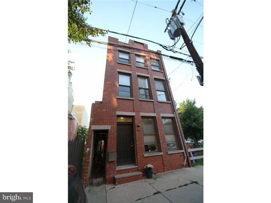 Welcome to this stunning and modern 4 bedroom, 2 bath home that was expertly renovated in 2005. Property located in rapidly developing South Kensington and is a stones throw from Northern Liberties, the Piazza, Taco Riendo, Crane Arts building and all the great restaurants in the area. Step into the first floor into the open grand living room and dining room, refinished hardwood flooring and plenty of room to entertain.  Kitchen is expansive and modern with high end cabinets, counter-top and stainless steel appliances.  The kitchen leads out to a nice patio area for grill and table with chairs, perfect for summer bbq and/or pets.   Take the stairs up to the second level that has two large bedrooms, laundry and shared bath. Third floor is expansive master bedroom suite complete with full bathroom. Don't miss out on touring the deck with amazing city views off of the master suite.   All mechanicals updated in 2005.  Roof has 2-year warranty.  Great comps in the area and new construction in every direction.  This is a must see and easy to show !