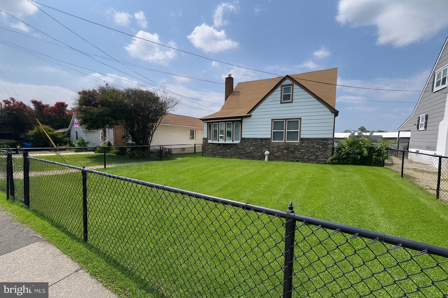 Updated and full of charm, this spacious single family home offers over 2,200 sq ft of comfortable living with 4 bedrooms and 3 full baths. Enjoy a fully fenced front yard, a flat backyard with a shed, a covered back patio perfect for relaxing or entertaining, and a private driveway with parking for multiple vehicles. Inside, the main level features beautiful hardwood flooring, abundant natural light, and an open-concept living and dining area. The stylishly updated kitchen is a standout with modern tile flooring, granite countertops, an elegant backsplash, center island with seating, and stainless steel appliances including a gas range. Two bedrooms and a full bath complete the main level. Upstairs, you’ll find two additional bedrooms and another updated full bath. The finished lower level offers a large carpeted flex space, an updated third full bath, laundry area, ample storage, and walk-up access to the backyard. This home has the space, style, and layout you’ve been seeking. Schedule your tour today! Dogs allowed with pet deposit. Professionally managed. **AGENTS PLEASE SEE DOCUMENTS SECTION AND READ CONFIDENTIAL REMARKS FOR MORE INFORMATION!**