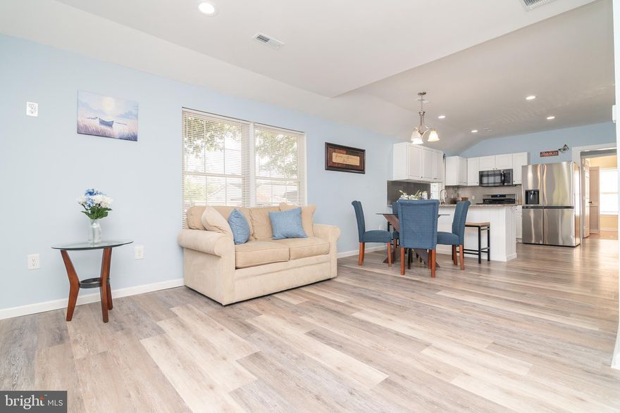 **The Moment You've Been Waiting For**
Venture into this beautifully renovated three-bedroom, two-bath rancher offering approximately 1,117 square feet of inviting living space. From the cozy, carpeted front porch—perfect for morning coffee or evening relaxation—you'll enter an open-concept living, dining, and kitchen area adorned with luxury vinyl plank flooring and bathed in natural light. The kitchen features stainless steel appliances, generous counter space, and a seamless flow into the dining and living areas, ideal for entertaining or quiet evenings at home. Two carpeted bedrooms with ample closet space share a stylish full bath with tile backsplash and a shower/tub combination. The primary suite is a true retreat, showcasing hardwood floors, a stunning exposed wood accent wall, and a modern ensuite with a tile walk-in shower and sleek hardware. Additional highlights include a stackable washer and dryer, a fenced backyard with mature trees, a fire pit, screened gazebo with seating, detached one-car garage, and extra parking for at least three vehicles. Whether you're hosting guests or enjoying peaceful solitude, this home offers the perfect blend of comfort, style, and outdoor enjoyment.