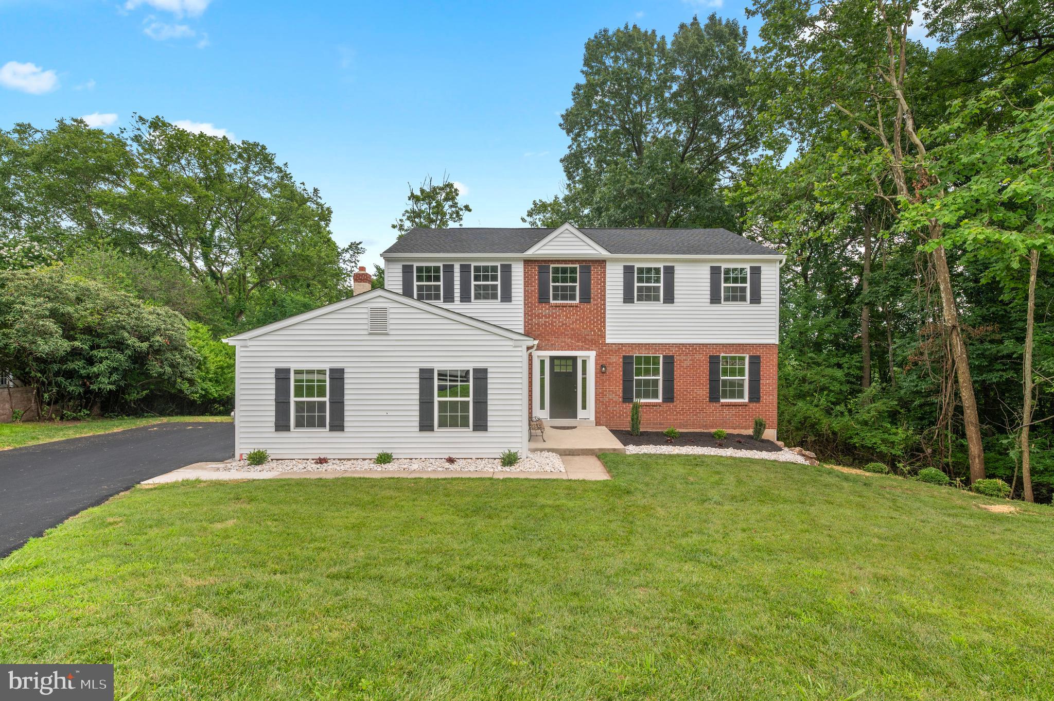 Nestled on a serene 1.54-acre lot, this beautifully updated single-family home offers modern comfort within an established neighborhood. The first floor features luxury vinyl plank flooring throughout, enhancing a bright formal living room, formal dining room, and a cozy family room complete with a wood-burning brick fireplace. The eat-in kitchen boasts brand-new white cabinetry, quartz countertops, new appliances, and a spacious pantry for storage. Additional conveniences include a stylish powder room, a mud/laundry room, and an attached two-car garage. Upstairs, the master suite impresses with a large walk-in closet and a fully renovated en-suite bathroom, featuring a single-bowl engineered stone vanity, tiled shower, brand new plumbing fixtures, and tile flooring. The second-floor hall bathroom has also been fully updated with modern finishes and fixtures. Brand-new carpeting spans the entire upper level. The partially finished walk-out basement offers extra living and storage space. Outside, enjoy the peace and privacy of a wooded backyard from the brand new composite wood deck. Just minutes from routes 422 and 363, shopping, and restaurants you'll love the convenience this home has to offer! First Month's, Last Month's, and Security Deposit totaling $12,000 due at the time of lease signing. Good credit (650+) and good rental history required. No short term rentals, minimum two year. Absolutely no smoking allowed.