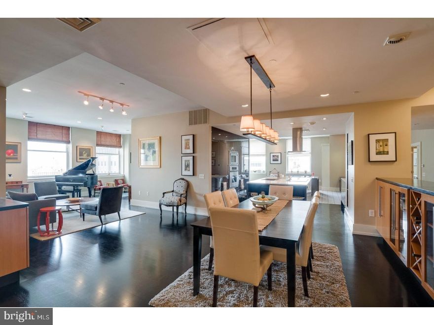 SIMPLY SPECTACULAR TRIPLE CORNER RESIDENCE BOASTING OVER 2400 Sq. Ft. with 3 bedrooms, 3 baths, and parking! Located on the 18th floor at the Phoenix in the heart of Center City, this property combines two condominiums to create one lavish living experience. Enter into a marble foyer that welcomes you to an open concept design with 10' ceilings and stunning views of the Parkway, City Hall, LOVE Park, or the Ben Franklin Bridge. The heart of this home features an open kitchen that is surrounded by the dining/living room with a bar station offering poured concrete counters and wide plank quarter saw White Oak hand stained black floors on one side, and a decadent family room with beautiful built-ins and Wool Stark carpeting on the other side. Cook up a storm in this Joanne Hudson designed kitchen, which is accented with marble counters, Dacor oven, cooktop and microwave, a Subzero refrigerator, and a double drawer dishwasher by Fisher and Paykel. To the west of the living room are two bedrooms and two bathrooms, both ample in windows and natural light. To the East, you will find the private master suite offering unobstructed views of the Benjamin Franklin Bridge, City Hall, and Love Park. All bedrooms have customized closets, doors, and wide base boards. Residents of the Phoenix enjoy a spectacular landscaped roof top terrace that includes a modern gazebo, outdoor grills, ample lounged seating, and absolutely breathtaking 360 degree views of center city. Additional amenities a 24 hour door person and concierge, media room, conference and business center, resident lounge and billiards, and fitness center. Valet parking for 2 cars available for an additional monthly fee. The world is at your feet with Suburban Station just below. Skip the hustle and bustle of traffic and take the train to the Philadelphia International Airport! Go from Philadelphia to Paris without ever stepping outside until you reach your destination!