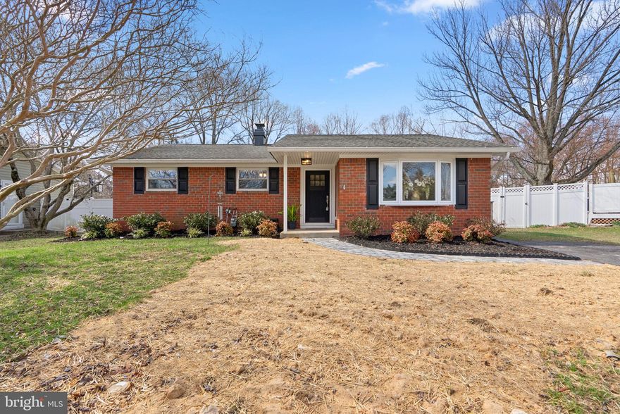 Must see totally renovated brick rancher in sought after Rippling Estates! Endless improvements include: New Carrier gas HVAC (2024); New siding (2022); New gutters, exterior trim and fascia (2021); New gas water heater (2020); Updated electrical panel w/200 amp service (2020); New front, side and sliding glass doors (2020); Rear fence replaced (2020); New sewer line (2025); Extensive landscaping w/brick paver walkway (2026); Replaced windows; Roof replaced by previous owner; Energy efficient solar panels for low utility bills; New luxury vinyl plank floors throughout foyer, kitchen and rec room (2025); hardwood floors throughout rest of the main level; remodeled eat-in kitchen w/white shaker cabinets, granite counters, subway tile backsplash, and upgraded stainless steel appliances; 3 bedrooms and 2 full renovated bathrooms complete the main level; finished lower level w/expansive rec room, remodeled half bath, laundry/utility/exercise room, and storage room; flat rear yard w/shed and multiple patios backing to wooded open space. No HOA or HOA fees. Minutes to shopping, restaurants, parks, major commuter routes, Ft Meade, NSA, BWI, Baltimore and DC!