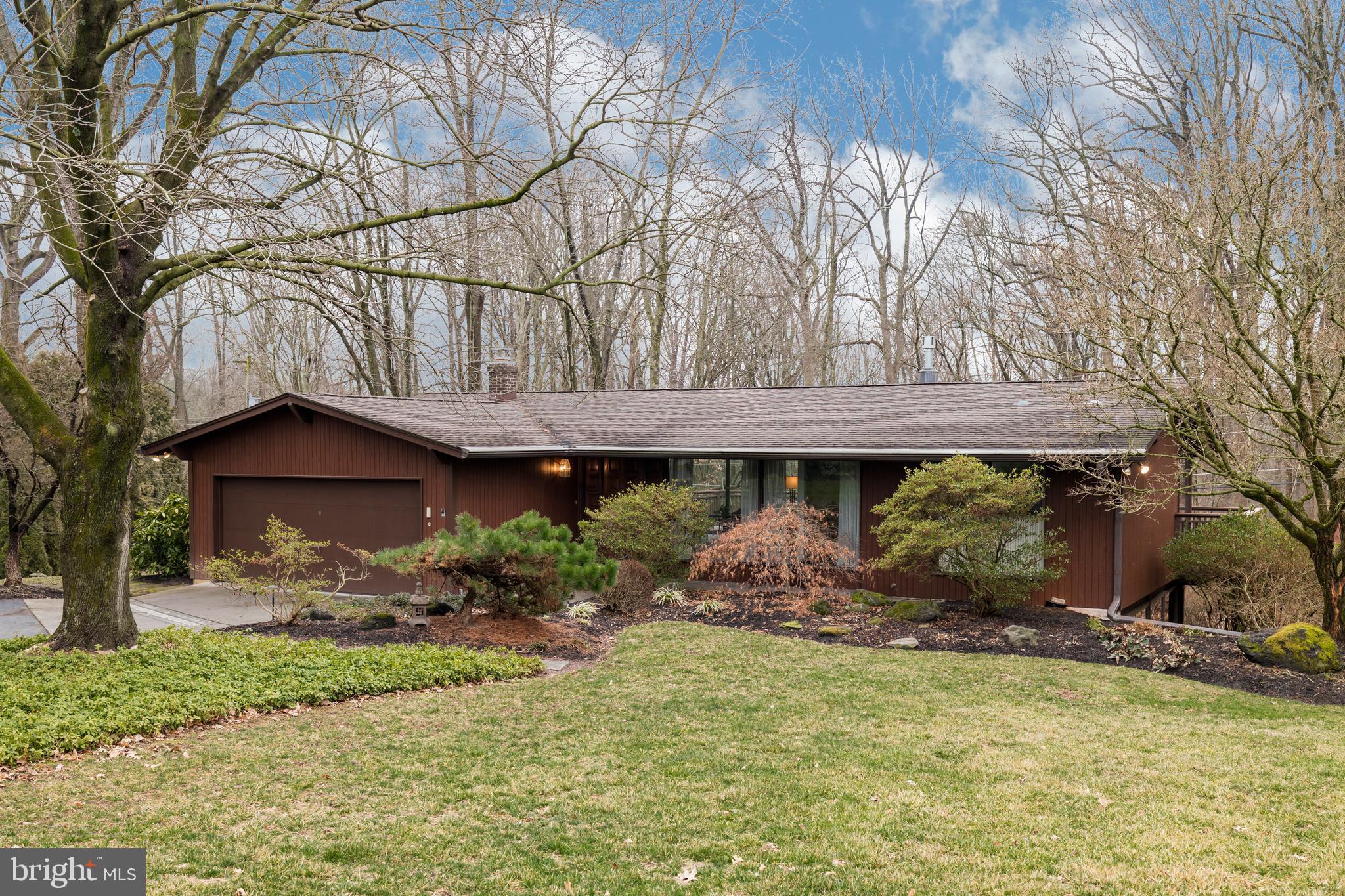 Welcome to the Unionville Chadds Ford School District! Privacy abounds in this hillside ranch home located on a quiet cul-de-sac with powerful vistas! You can truly live on one floor with additional growing room on the lower level. Walk in to the  open living room-dining room with massive windows. Bring the outdoors in! The living room has a gas stove that heats the entire room, ceiling fan, open beams and access to the oversize deck that looks out to your private rear yard. The dining room adjoins the living room and shares the same massive windows and deck.  The kitchen boasts beautiful cherry cabinets, granite counter top, tile back splash, stainless steel appliances and breakfast bar. The master bedroom is large and also has massive windows that view your private rear yard. There is an oversize closet, new carpet, vaulted ceiling and ceiling fan. The hall bath has a new toilet, vessel sink, granite top and marble floor. The lower level consists of three additional bedrooms. One bedroom is currently being used as an office. The fourth bedroom is currently being used as storage. There is a large family room with doors that lead to the rear yard. This level also houses a full bath with a walk in shower, new toilet, granite sink top, linen closet and tile floor. The laundry room is on this level and has a laundry tub and plenty of storage. There is a two car garage with opener, hard wired whole house generator and water softener. On the main level there are hardwood floors under the carpeting. The property is wired for Verizon Fios or cable. Low taxes. Close to everything with an easy commute to Delaware.