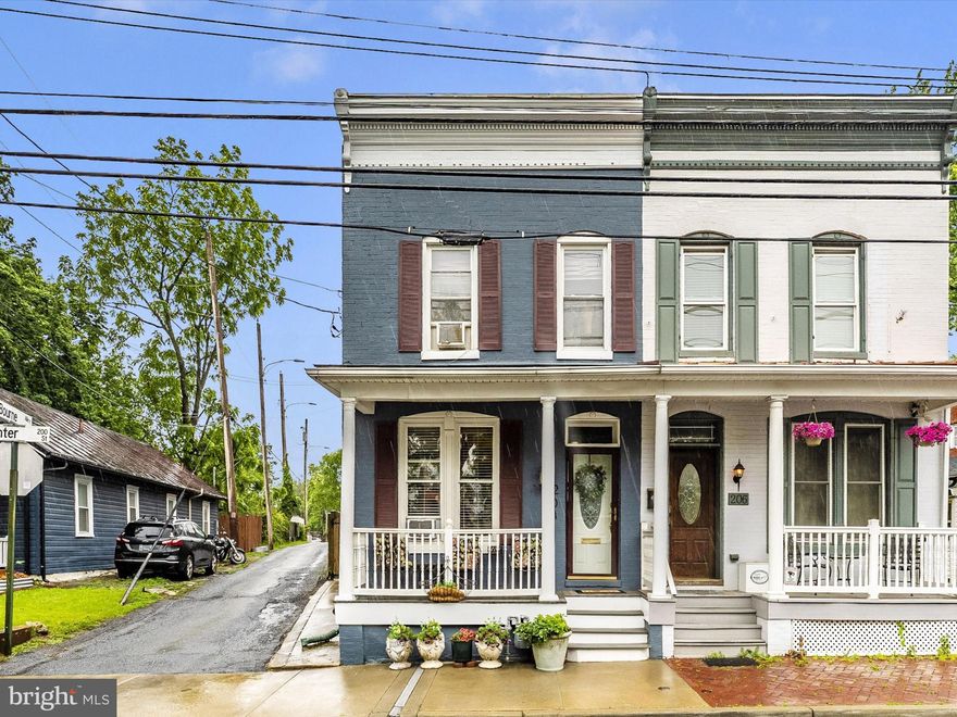 Step inside this charming, well-maintained home and fall in love! Offering the perfect blend of comfort and style, it features a separate living room and dining room with beautiful laminate wood floors throughout the main and upper levels. The kitchen shines with granite countertops, a brand-new range/oven, a newer stainless steel refrigerator, a built-in microwave, and ceramic tile flooring  ready for your next culinary adventure.  A convenient half bath completes the main level.  Upstairs, you'll find three spacious bedrooms, a full bath, and a large walk-in closet in the rear bedroom, offering plenty of storage space. The finished basement adds even more living area, complete with a full bathroom and a laundry zone.  Enjoy outdoor living with a covered front porch and a charming fenced backyard, ideal for relaxing evenings. The oversized detached one-car garage is electrically wired, includes bonus storage on the upper level, and features a paved parking area for four cars.  Located just a short stroll from Baker Park, Carroll Creek, vibrant Downtown Frederick, the MARC Rail station, and countless shops, restaurants, and entertainment options, this home offers both convenience and lifestyle. Easy access to major commuter routes makes daily travel a breeze.  Don't miss out — your dream home is waiting!