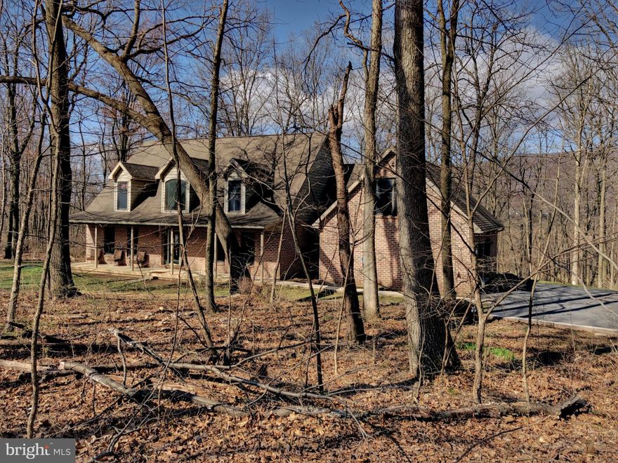 Custom built brick cape cod on 3.77 acres offers over 3,000 sq ft of living space.  4 bedrooms, 2.5 baths.  Custom maple cabinets, stairs, railings and trim through out the entire home.  2 story living room with open hallway along 2nd floor, large laundry off of the kitchen with walk in pantry.  French doors lead to separate dining room or home office/den.  All appliances convey.  1st floor master bedroom, master bath with custom walk in ceramic tile shower, whirlpool tub, onyx counter tops.  Dual staircases to 2nd floor.  Full unfinished basement, over sized 2 car garage with utility area and additional entrance. Rear sun room leads to stone patio.  Dual zone heat pumps, new water treatment system.