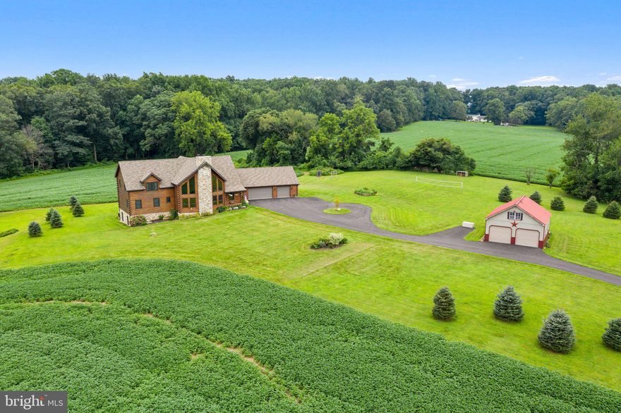 STUNNING & PRIVATE, This home built in 2016, property overlooks 31.6 acres of rolling hills and woods with a creek running through the middle of the woods. Conservation easement with London Grove township allows land to be divided one more time which offers investment opportunities.  This 4 bedrooms home, featuring a 1st floor Master suite offering today amenities, a MUST SEE! Enter the main Family/Great room with floor to ceiling stone fireplace with built-in blower, Ceiling Fan & wide plank pine floors thru out 1st & 2nd floors. This open Floor Plan, Kitchen features high-end granite, stainless steel appliances, butlers bar with wine refrigerator and ample cabinet space. Slider to the Trex deck overlooking rear yard and private wooded area, adjoins the screened in porch for sunsets afternoons! The Mudroom provides a 2nd front door & access to the breezeway with attached 3-car garage, circular driveway provides access to the detached 2-car garage/barn with loft. Take the wide open staircase to the 2nd floor featuring 3 additional bedrooms, all with ceiling fans & ample closets & 2 full bathrooms. Lower level is finished with 2nd family room, full kitchen area, gym & 5th bedroom/2nd office. Built with High-end designed electrical features & Geothermal! Views from all windows of the Chester County Countryside!  Many options for this amazing piece of property! Enjoy the serene Campfire site with maintained walking trails on the land and through the woods. Deer, turkey, wildlife everywhere.  Adjacent to a gravel walking trail next door.  Complete privacy and peaceful serenity.  Current Lease option with local farmer offers more income opportunities as well.  LOW Taxes!
