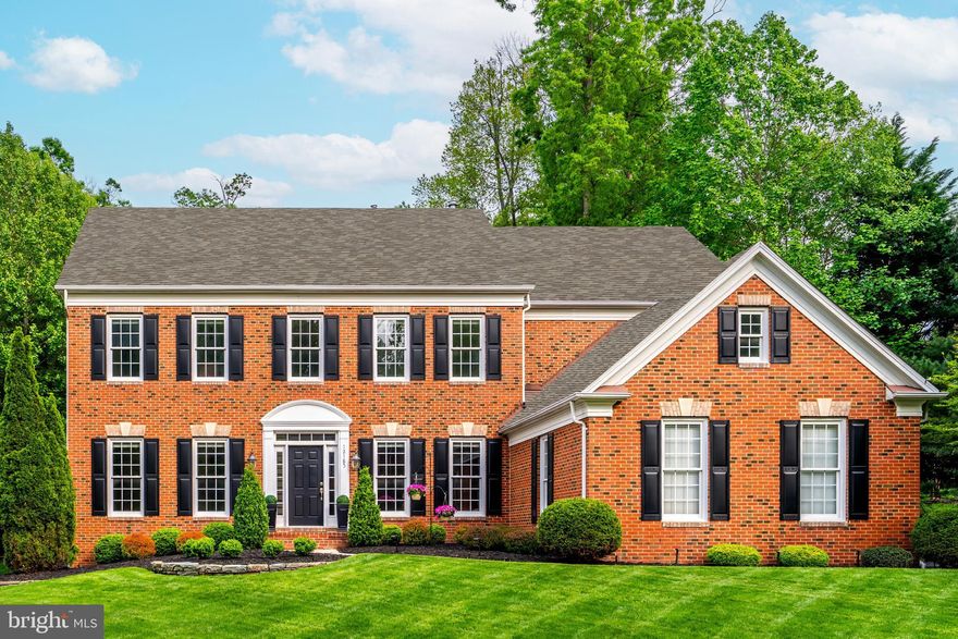 Nestled in the exclusive Dartmoor Estates community, 12185 Wild Horse Drive in Fairfax, VA, is a striking brick Colonial residence offering a harmonious blend of elegance and functionality. This impeccably maintained home proudly displays the owner's dedication to quality and style and pride in home ownership.

Upon entering, you are welcomed by a grand two-story foyer bathed in natural light, leading seamlessly into an open floor plan that expands across 6,000+ square feet of finely appointed living space. The main level is graced with timeless solid oak finished-in-place hardwood floors and a neutral color palette that enhances the home's sophisticated ambiance.

The renovated chef's kitchen stands as the heart of the home, featuring gleaming granite countertops, new stainless steel appliances, elegant white cabinetry and an island for all your food preparation needs. A spacious breakfast bar and eat-in area offer lots of seating, while a sunroom bump-out with floor-to-ceiling windows provides breathtaking views of the expansive, flat backyard—a perfect setting for both quiet mornings and lively gatherings.

The family room, adorned with a captivating gas fireplace and two-level stone surround, offers a warm and inviting atmosphere. This home is tailored for entertainment with its formal living and dining rooms and butlers pantry. The beautifully appointed home office is perfectly situated providing a quiet and spacious work area.

Retreat to the upper level of this exquisite home, where elegance and comfort converge. Prepare to be impressed by the expansive primary bedroom, a true sanctuary featuring a tranquil sitting area and a stylish bump-out. The renovated, sophisticated ensuite bathroom offers a stand-alone soaking tub, a separate shower with frameless glass surround, and dual vanities with quartz countertops, all complemented by an enormous walk-in closet that caters to all your storage needs with grace.

In addition to the primary suite, the upper level encompasses three generously sized secondary bedrooms, each adorned with multiple windows that invite natural light. These bedrooms offer ample closet space, ensuring that everyone enjoys their private haven. Two renovated, neutral bathrooms with quartz countertops enhance the upper level's appeal: one an ensuite and another a convenient Jack-n-Jill style, providing accessibility and comfort.

Descend to the walk-up lower level with a gas fireplace and wet bar where a world of leisure and convenience awaits. This space is designed to be the ultimate entertainment hub, perfect for hosting gatherings or enjoying personal relaxation time. The versatile and inviting level is ideal for creating the entertainment space of your dreams with space for media viewing, a billiards lounge, play area and a home gym. The level also houses the 5th bedroom and 4th full bathroom. All your storage needs are also effortlessly met with ample space for organizing belongings.

The expansive .06 acre lot and deck with built-in hot tub offers a serene outdoor retreat, seamlessly blending nature and tranquility providing ample space for a variety of outdoor activities. The yard's natural beauty creates an inviting backdrop for both relaxation and entertainment, making it the perfect complement to the elegance found within the home. Within the highly rated Waples Mill ES, Franklin or Carson MS and Oakton HS FCPS school pyramid and located within minutes to major commuter routes and an abundance of shopping and dining, this home is a true gem.  Don't miss this opportunity to make it your own!