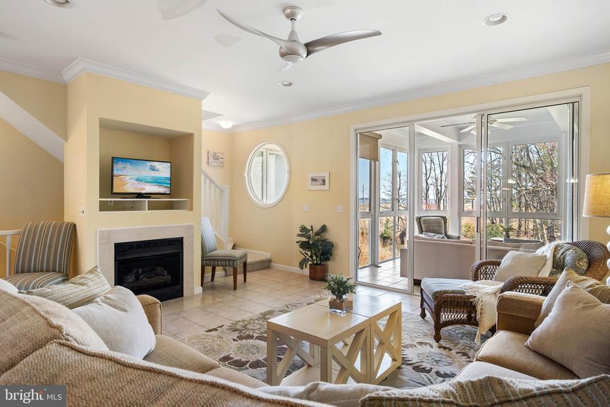 With lush wetlands, wildlife, and calming water scenes, this is your opportunity for peaceful living just under 3 miles from the beach. Whether a fun getaway or a strong investment, this is a dream come true. This rare 4-bedroom home features a garage with ample storage, first-floor laundry—keeping the sand at the door—and a bedroom with en-suite bath opening to a sunroom overlooking wetlands, canal, and water. The open-concept main floor is well-appointed: a bright kitchen boasting a pantry and a breakfast bar flows effortlessly into the dining, living areas, and the sunroom, all bathed in natural light, complete with a cozy fireplace and relaxing outlooks. Upstairs, three more bedrooms serve as a bonus, including a primary suite with en-suite bath and a private balcony—perfect for tranquil mornings as you soak in the landscape. Bayville Shores, a premier waterfront and pet-friendly community, offers large ponds with water features, tennis, pickleball, basketball, volleyball, gym, boat ramp, kayak launches, and scenic walking paths. Now is your chance to enjoy wetlands, green space and waterside living at its finest—make it yours today!