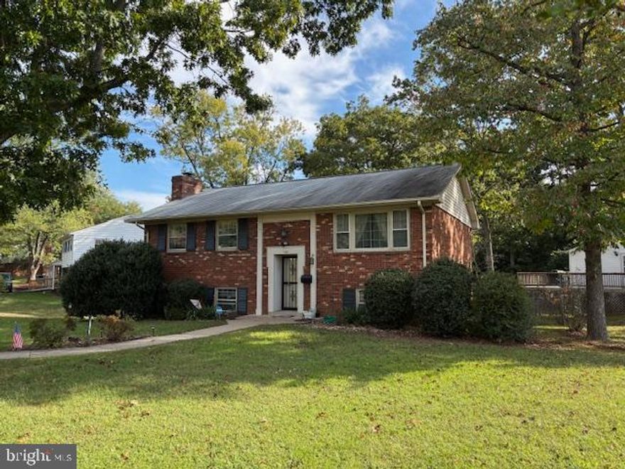 Close and be in for the Holidays! They just don't build them like this anymore true pine wood studs and truss'. One owner home (mother) very well maintained 3 Bedroom 2 full bath, 1 car garage with built in shelving with many garden tools, etc. that convey. Brick Split Foyer on a corner lot adjacent to Spotswood Elementary School convenient for a family with school age children. Large utility room/recreational room combo. Fully wrapped soffit, windows, door trim, concrete walkway to the street. with Motion lights front of the home. Family room offers a wood burning fireplace for those special cozy Thanksgiving/Christmas family gatherings which we enjoyed for many years (over 50). Beautiful hardwoods in bedrooms (believed to be hardwood under carpet) on the main. Huge picture window in the living room with designer curtains. Pocket doors in kitchen, and main bedroom to full bath. Great safe neighborhood to raise kids. It is worth your time agents to bring your best clients.