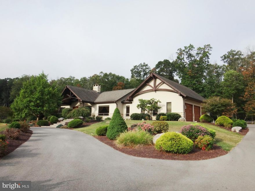 Elegant contemporary home features 4 bedrooms, 2.5 baths with a total of 4,088 sf living space. This custom built home offers open floor plan for indoor and outdoor entertaining including a 40 x 15 rec room and 31 x 12 exterior patio with built in fireplace/grill. Heated floors on both levels along with the dual fireplace in living room-den. Spacious over-sized garages for 3 vehicles plus storage.