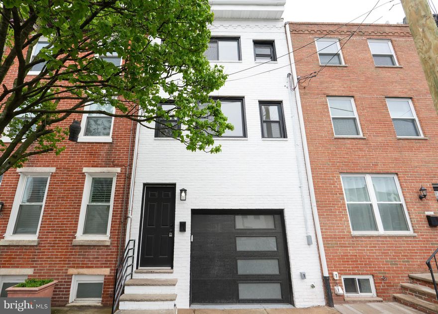 Discover this unique, one-of-a-kind property offering a minimalist lifestyle paired with modern amenities. Features include an attached garage with automatic door, central air, and an updated kitchen. Ideally located in Pennsport neighborhood, you will love the vibrant community feel where residents enjoy a blend of historic charm and modern growth, with walkable access to local eateries, green spaces, Delaware River waterfront, plus easy access to public transportation and major highways - making this home a perfect mix of style, comfort, and urban accessibility.