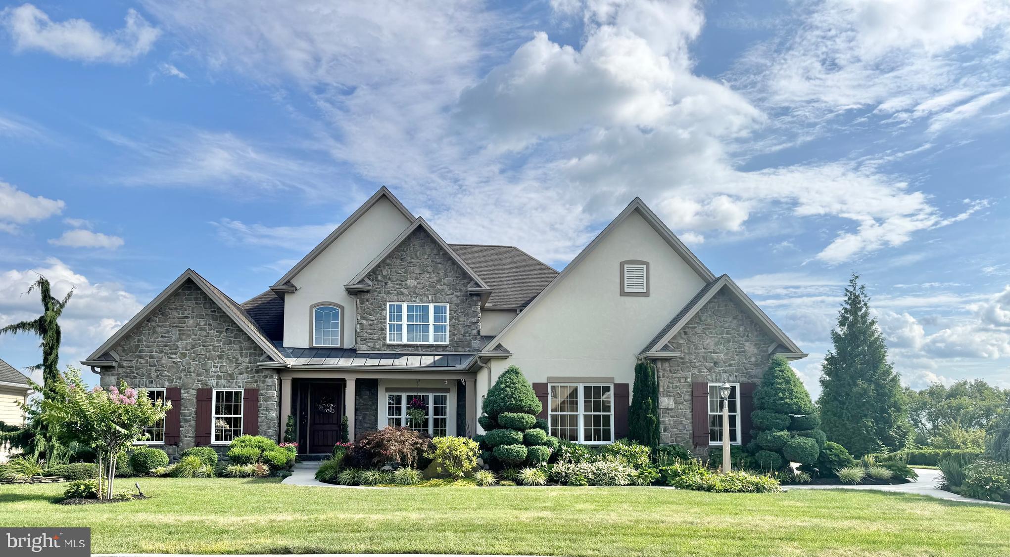 🏡 COMING SOON! Exquisite Hampden Summit Estate | 4 Bed | 3.5 Bath | 3-Car Garage | Panoramic Views
Step into unparalleled luxury in this stunning Hampden Summit residence, custom-built by Carlson Construction, where exceptional craftsmanship meets elevated living.
From the moment you arrive, you’ll be captivated by the expansive 3-car garage, professionally landscaped grounds, and a tranquil front koi pond. Enter through a grand 48" front door into a welcoming foyer that sets the tone for the home’s elegance.
To the left, a formal living room or office features French doors for privacy. To the right, a beautifully appointed dining room stuns with a stone archway and built-in buffet—ideal for entertaining.
The heart of the home is the two-story family room, showcasing expansive windows, an elegant two-sided stone fireplace, and 18-foot ceilings that flood the space with natural light. All windows feature custom Hunter Douglas wood blinds, including remote-controlled blinds in the family room.
The chef’s kitchen is a dream:
Viking appliances
Custom cabinetry
Tiered island with pendant lighting
Sunny breakfast nook overlooking breathtaking scenery
The first-floor Owner’s Suite is a private retreat with a tray ceiling, spa-inspired bathroom, and a California Closets-designed walk-in closet.
Upstairs, you’ll find three spacious bedrooms, including two currently furnished with king-size beds—perfect for guests or family.
The walkout Lower Level is a true extension of the home—not a basement—with 9-foot ceilings, high-end finishes, a full bath, and direct access to a hot tub oasis.
Outdoor Living at Its Finest:
Elevated Trex deck with panoramic views of Bayshore Farm and all the way to Ski Roundtop
Two sitting areas plus a fully equipped outdoor kitchen
Additional private entertaining areas along the side and rear of the home
Additional Features:
Open-concept layout ideal for modern living
High-end finishes and fixtures throughout
Rich walnut hardwood flooring
Located in Hampden Township, within Cumberland Valley School District
This is a rare opportunity to own one of the most exceptional homes in Hampden Summit—where every detail is thoughtfully designed, and the views are simply unforgettable.
