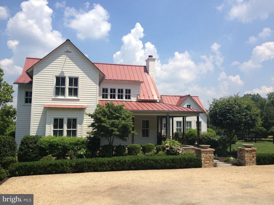 PRICE REDUCED!!!  Property appraised for $2m in April 2013.  Superbly maintained contemporary farmhouse in exceptional setting. 50+ acres of rolling hills w stream running through it.  20 cleared 30 wooded acres.  Main level master suite; Views from every room; Gourmet kitchen; Stellar landscaping and delightful outdoor ambience; Ideal horse property - 4 stall barn w wash & tack room. A must see!