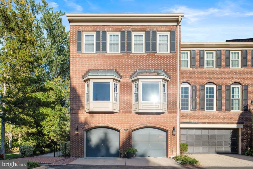 Large four level end unit townhome blends timeless architectural detail with refined modern updates. The result is a home that feels both sophisticated and welcoming. Unique lot with perfect privacy. Elegant living. Steps to downtown McLean,  Minutes toTysons Corner, and a few miles to Washington DC, the location balances accessibility and serenity. A brick ramp eases into the front door and a gracious foyer opening to a private library. Setting a tone of quiet elegance. The main living level unfolds with soaring ceilings, a sunlit living room, and a raised dining room that invites easy entertaining. Gorgeous kitchen shines with custom built ins, granite surfaces, stainless steel appliances, and beautiful hardwood floors that flow throughout. Evan a cork floor work station. The family room gathers natural light and frames the breakfast area, deck and landscaped garden for a true indoor and outdoor connection. 
Generous primary suite is a calming retreat with vaulted ceilings and soothing treetop views The remodeled bath includes a water closet and walk in shower,  walk in and wall closet  closet system. Two additional bedrooms full hall bath,  jetted tub, and laundry complete this level.
The top level offers flexible living for a guest suite or private office with built ins, two walk in closets, and abundant storage. 
The entry level, stylish lounge with a wet bar opens to the screened porch and Georgetown brick patio bordered by mature landscaping. Bath on this level. There is direct access to the two car garage,  plus elevator space that serves three levels. Recent updates include fresh paint, new carpeting, renovated kitchen, bathrooms, and upgraded lighting. As a corner end unit, the home enjoys natural light on three sides and lush green views from every level.
Located in the Churchill Road Elementary, Cooper Middle and Langley High School pyramid. A rare turnkey opportunity in one of McLean’s most desirable neighborhoods.