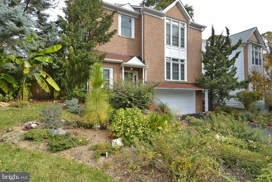 Well maintained contemporary home with beautiful hardwoods, recessed lighting & good natural light. Spacious table space kitchen opens to family room w/fireplace and deck overlooking garden. Master bedroom/bathroom suite. Fully finished lower level. 2 car garage/driveway. PRIME LOCATION in cul-de-sac, 3 blocks to Whole foods, fountain, restaurants, ice rink.  Short walk to Metro, parks.