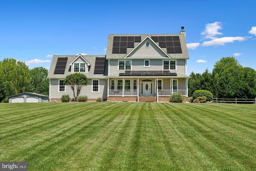 Perfectly situated on over an acre, this custom-built masterpiece offers over 4,000 SF with three fully finished levels thoughtfully designed for luxurious living and effortless entertaining. From the moment you arrive, you'll appreciate the meticulous care, craftsmanship, and extensive upgrades this home has to offer. Step inside to find a spacious formal dining room framed by elegant segmental archways, setting a warm and inviting tone. The main level flows seamlessly into the heart of the home — the gourmet kitchen — featuring soft-close cabinetry, a large center island, dual ovens, under-cabinet lighting, an induction cooktop, a spacious walk-in pantry, and a reverse osmosis water filtration system connected to both the kitchen sink and refrigerator. Adjacent to the kitchen, a cozy breakfast nook provides the perfect space for everyday meals. The expansive family room offers the ideal gathering place, complete with a pellet stove, a beautiful wet bar perfect for entertaining, and oversized sliders that fill the space with natural light. These sliders open directly to the screened-in porch — newly updated with pet-resistant screens — and lead to an attached deck, creating even more space for outdoor relaxation. Upstairs, the second level is designed for ultimate comfort. The luxurious oversized primary suite features a private propane fireplace, dual walk-in closets, and a spa-like en-suite bathroom with a luxury stone jacuzzi tub, rainfall shower, abundant natural and overhead lighting, and separate his-and-hers vanities. Two additional bedrooms with spacious closets, a large bonus room with a pellet stove (ideal for a recreation room or optional sixth bedroom), and a second full bathroom complete this floor. For added convenience, a second-floor laundry room makes everyday living even easier. The third level offers two more versatile bedrooms, a full bathroom, and access to the HVAC system — perfect for home offices, guest suites, or teen retreats. The solar panels will be paid off before closing The outdoor space is just as impressive. Enjoy a  fenced in yard, ideal for children and pets to safely roam, an oversized attached 2-car garage with access to the crawl space, a detached 2-car garage that makes an excellent workshop, storage space, or man cave, plus an additional storage shed. A partial whole-house generator provides added peace of mind. And the best part? No HOA! Located just minutes from downtown Centreville's charming shops, restaurants, marina, and parks, with easy access to Route 301 and only 13 miles from the Bay Bridge, this property truly leaves no comfort feature overlooked. Welcome to a home where luxury, privacy, and convenience meet — your Eastern Shore dream awaits.