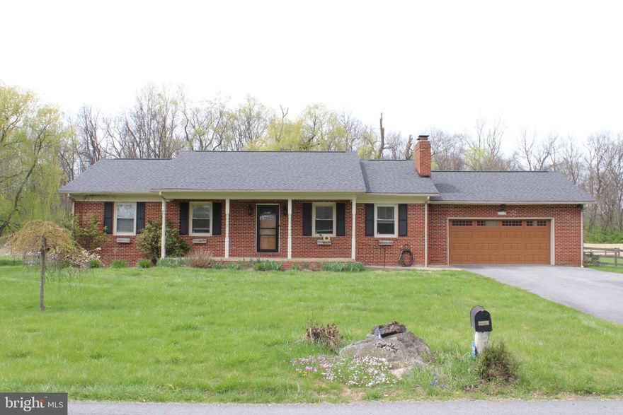 Well maintained Rancher on 2.38 acres just minutes from VA/WV line located on a lightly traveled section of Gold Miller rd.  House features a newly updated modernized kitchen, New roof in 2022, hardwood in the living room with wood burning fireplace.   Master bath has been updated as well.  Floor plan consists of 3 bedrooms and 2 full baths , central air/heat with Laundry on the main floor situated on an unfinished basement that could be finished for more living space.   Basement has a walkout to the side yard as well as a connecting stair off the Kitchen.   Oversized garage is 23' by 22' and back deck is approx 40' by 16' that leads to the backyard.   Back yard is fully fenced and has a nice flowing wet weather stream and a run in shed.  Plus, there is a separate fenced section set up for gardening.  Though minutes from shopping and interstate access its truly in a country setting so don't miss the opportunity to make this home your own!