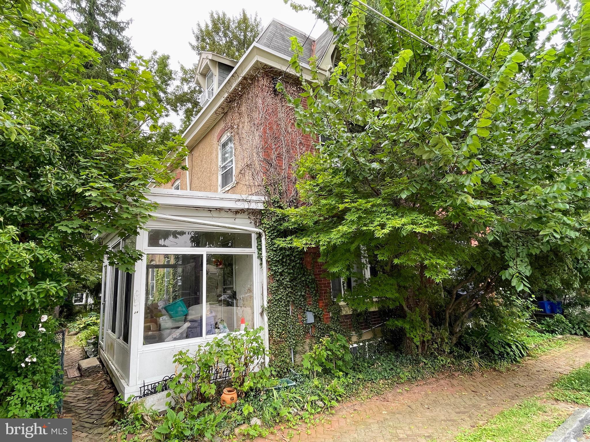 Come discover the unique potential of this 3-story twin home in the sought-after West Mt Airy neighborhood. Nestled on a picturesque tree-lined street with a spacious, level lot, this property features a large backyard and charming side gardens. With an inviting sunporch, and an abundance of windows that enhance its architectural character, this is a rare opportunity to transform a classic Mt Airy home with endless possibilities. Please note: this property is being sold “as is” and no repairs will be made.