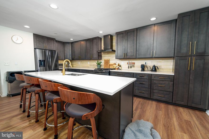 Welcome to 900 S Hanover St, a househacker's dream!  This turnkey two unit property in the heart of Federal Hill has been meticulously updated and offers highly rentable units that can help offset your mortgage! Featuring one 1bd/1ba unit and a fantastic 2bd/1ba two-level owner's unit! Both units feature quartz countertops, upgraded appliances, new bathrooms, laundry, new central air, laundry and upgraded flooring! The lower level 1bd/1ba is spacious and offers a large living room, roomy bedroom and galley kitchen. The upper level owner's unit is one-of-a-kind and offers a chef's kitchen that is rivaled by few homes in the neighborhood! Featuring an oversized island, ample cabinetry, quartz countertops and black stainless appliances, the kitchen offers every amenity you could imagine for all of your cooking needs. Upstairs includes two spacious bedrooms, a fully-renovated bathroom and access to laundry. Both units also offer access to outdoor space for a breath of fresh air. Stop in today as this one won't last long!