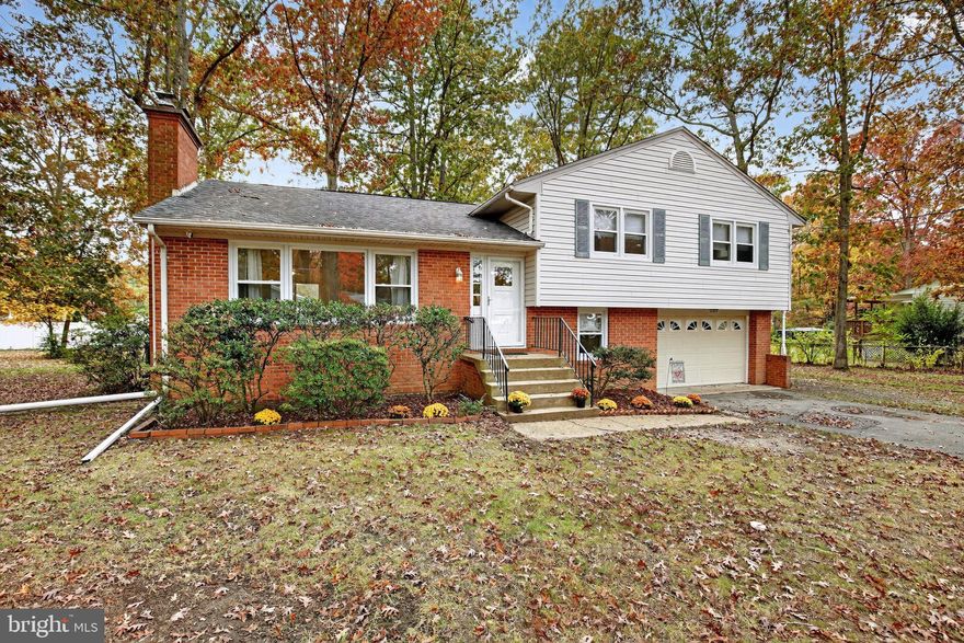 Tucked away at the end of a quiet cul-de-sac in the Greenview Knolls neighborhood, this spacious four-level split-level home offers both character and convenience—with no HOA! Featuring four bedrooms and two and one half baths, the home provides a comfortable layout with room for everyone.

The main level showcases hardwood flooring, a welcoming foyer, a formal living room with a wood-burning fireplace (utensils convey), a separate dining room, and a bright eat-in kitchen that was beautifully replaced in 2021. A sliding glass door leads to a large rear deck—newly replaced in 2025—perfect for outdoor entertaining.

Upstairs, the primary bedroom includes a private ensuite bath, while three additional bedrooms share a hall bath. All upper-level bedrooms feature gleaming hardwood floors.

The lower level offers flexibility with a fifth bedroom or office, a laundry room that hosts a convenient half bath, and access to the one-car garage. The basement provides two spacious rooms ideal for a recreation area, game room, or extra storage, plus two sump pumps for peace of mind. The owner updated the HVAC system in 2022.