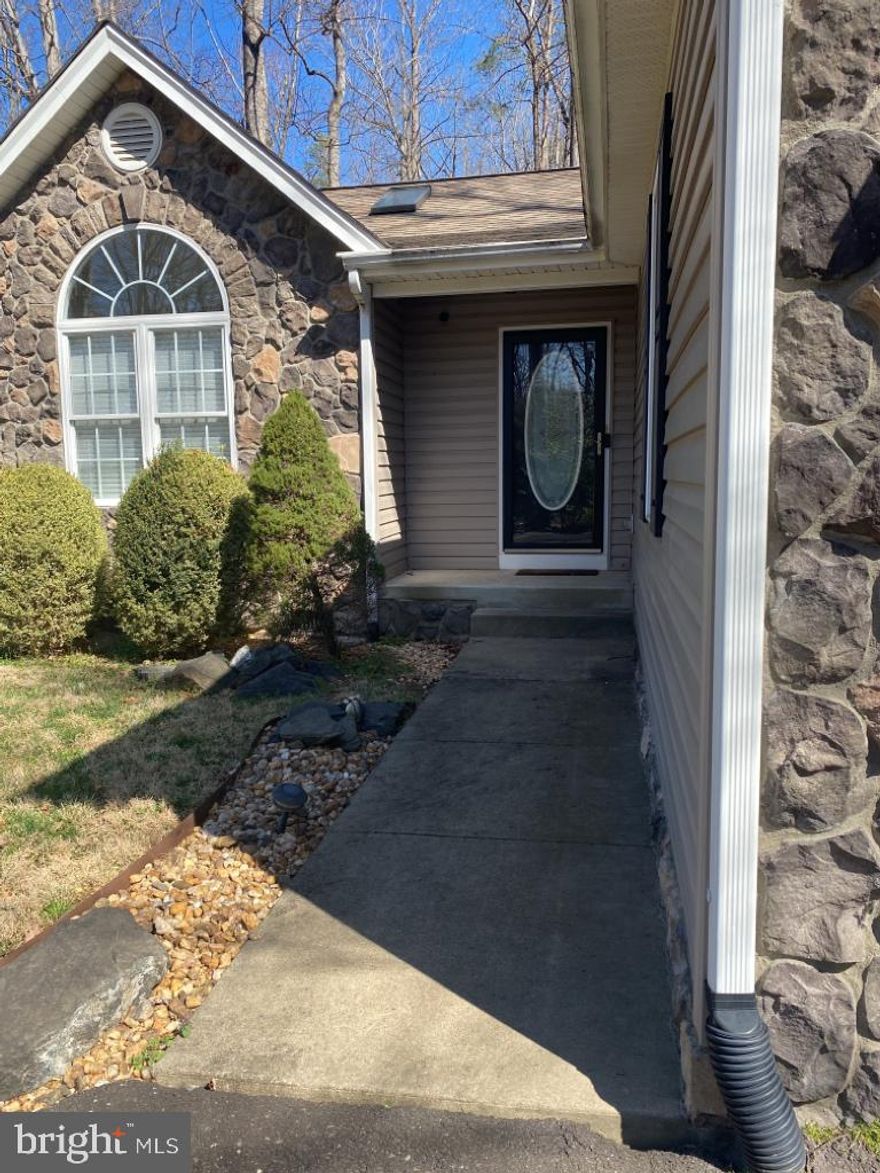 Step into your dream home! This exquisite residence is bathed in natural light, highlighting the elegant cathedral ceilings that create a sense of spaciousness and serenity. The gourmet kitchen is a chef's delight, boasting sleek appliances including a refrigerator, electric range/oven, and dishwasher, ensuring meal preparation is both stylish and convenient.Entertain guests or unwind with loved ones in the inviting living room and dining area, perfectly designed for gatherings and relaxation. The unique split bedroom layout offers privacy and tranquillity, with the primary suite featuring a custom-designed primary bath complete with a luxurious triple-head steam shower and artisan vanity – a true oasis of indulgence.

For added convenience, a washer and dryer (as-is) are included, simplifying your laundry routine. Outside, the 2-car garage provides ample parking and storage space for your convenience. Don't miss this rare opportunity to reside in a stunning lake house, offering not only a luxurious living experience but also access to an array of community amenities including basketball courts, a beach, boat ramp, golf club, swimming pool, and much more!

Pets are considered on a case-by-case basis, with the owner eager to ensure a harmonious living environment. Share details about your furry companion, and a picture for approval, to secure your place in this magnificent home. Apply now to start living the lakefront lifestyle you've always dreamed of!

This is a gated community. Prospects will have to let the front gate know they are there for a viewing at the property.
Front Gate Phone: (540) 972-2210