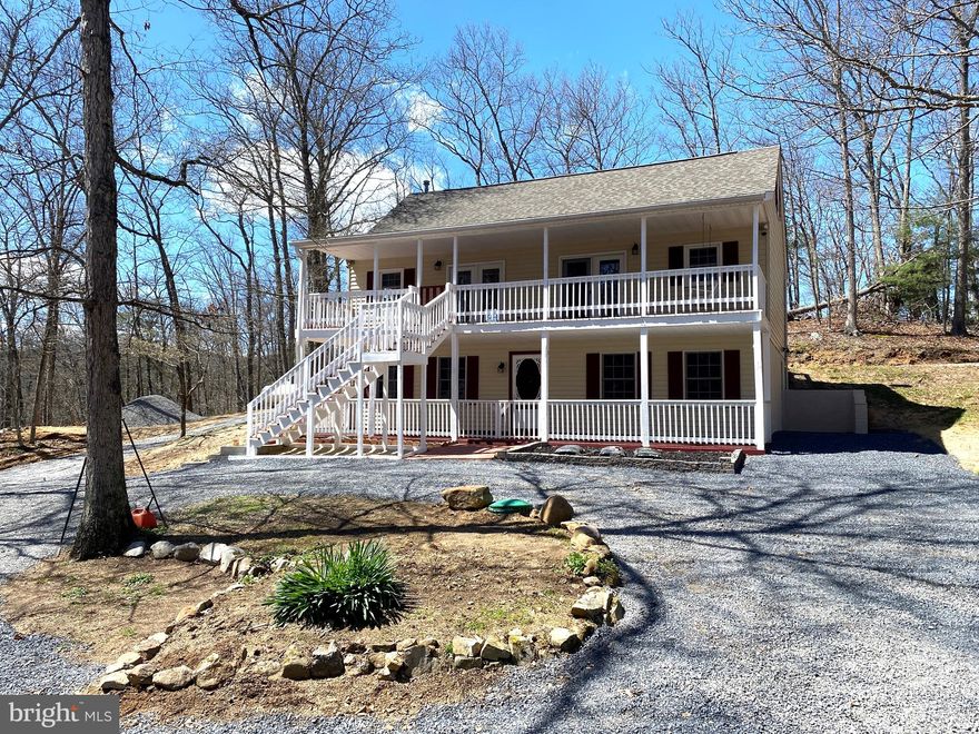 4 Bedroom/3 Bathroom Home Nestled on 5 Wooded Acres! – Welcome to this beautiful,  recently remodeled home on 5 acres, offering a perfect blend of privacy, comfort, and nature. The community offers a swimming lake with beach, playground, picnic pavilion, tennis court and a separate fishing lake (stocked). This spacious  home spans across three levels, providing ample room for living and entertaining. On the main level you'll find  one of the bedrooms and baths. The kitchen has stainless appliances and french doors  leading to the back deck perfect for your BBQ grill. Off the kitchen is a nice open space that could be used for formal dining or a cozy living area.  Additionally,  there  is a  large walk-in closet that would make the perfect  kitchen pantry and also a large family room! Upstairs is a spacious, private retreat with  2  generously sized bedrooms and full bathroom to accommodate  family members, guests, or a private home office. The lower level offers versatile space that could be used as a game room, recreation room,  or an  escape for hobbies and relaxation. The 4th bedroom and additional full  bathroom are located on this level. The home boasts two full-length porches, ideal for enjoying your morning coffee or watching the sunset over the  wooded landscape. Whether you’re looking to unwind in your porch swing, entertain, or simply connect with nature, these expansive outdoor spaces offer magnificent views. This 5-acre property is a wooded wonderland, providing seclusion and tranquility while still being just a short drive from local amenities. Schedule a tour today and experience the charm and peacefulness of this extraordinary property! A peaceful retreat awaits!