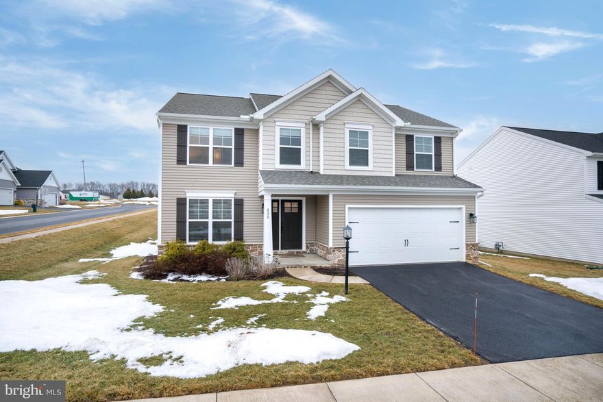 Welcome to 620 Fawn Valley Road, a beautifully maintained home set on a desirable corner lot in the sought‑after Nittany Glen community. This 2‑story home showcases the thoughtful design and livable flow the Burberry floorplan is known for, offering 4 bedrooms, 2.5 baths, 2,186 sq ft, and a full unfinished basement for future expansion or abundant storage. From the moment you arrive, the inviting front porch and manicured landscaping create standout curb appeal. Step inside to a bright foyer that opens to a dedicated office with French doors, ideal for remote work or a quiet retreat. A convenient half bath sits nearby. The main level features LVP flooring throughout and an open‑concept living, dining, and kitchen combo that makes everyday living and entertaining effortless. The kitchen blends style and function with white shaker‑style cabinetry, polished dark granite countertops, a dedicated pantry, and glass sliders leading to the back deck. A first‑floor laundry room and mudroom connect directly to the oversize 2‑car garage. Upstairs, a spacious and airy family room offers great flexibility. Three bedrooms and a full bath sit on one side of the family room, while the expansive primary suite enjoys its own private wing. The suite includes its own bath with a glass‑enclosed shower and a generously sized walk‑in closet. The full, unfinished basement offers endless potential—home gym, workshop, storage, or future finished living space! Nittany Glen offers quiet, walkable streets, a strong community feel, and convenient access to shopping, dining, and downtown State College. With its modern layout, thoughtful upgrades, and standout lot, this home is truly move‑in ready. See it today!