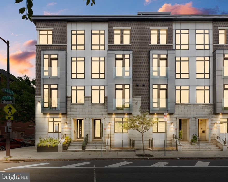 Highly Motivated seller:  Welcome Home to this prestigious modern/contemporary Baldwin Luxury Townhome in Old City Philadelphia. This spectacular townhome features 5 bedrooms, 4-1/2 bathrooms with heated floors, spacious living room with walk out balcony, and a dining room with a wet bar.  Gourmet eat in kitchen with luxury appliance package and quartz counters and island, attached two car garage. 
  When you enter this beautiful home you are in the main landing with a full coat closet, 1/2 bath and small sitting area with a door to the expansive two car garage with pantry storage. The garage features an upgraded floor covering and low profile upgraded garage door opener.  You head downstairs to the lower level currently set up as a gym (or can be a 5th bedroom) with a full bath, walk-in shower and heated floors.  The utility/mechanical room is also on this level.  There is an upgraded water filtration system in utility room (presently not connected) 
When you head upstairs from the front foyer you enter the spacious main living room with a walk out patio for additional entertaining space featuring porcelain slate floors, gas fireplace, 9’ ceilings, dining area with a wet bar, The open kitchen has a quartz island, modern cabinets, quartz counters, 5 burner gas cooktop, two built in wall ovens and a built in microwave oven & dishwasher, custom range hood. All appliances are high quality stainless professional grade appliances. You can use the kitchen space or the wet bar space for a nice dining area.   There is a door with a Juliet balcony off the kitchen for added charm.  The next level offers two bedrooms one smaller room with hardwood floors would be nice as an office.  The primary bedroom on this level also offers a Juliet balcony and floor to ceiling windows overlooking 2nd Street, and an 80" wall mounted TV and controls for the sound system that is throughout the home.  The primary bath room has a soaking tub, heated floors, double vanity, walk in shower, fully tiled walls and a built in TV and two large walk in closets.  The next level has laundry room with front load washer and dryer and utility sink along with an additional heating and air unit for 2nd zone.  There are also two additional bedrooms and a full bath on this level.  The rear bedroom offers access to the 2nd walkout balcony.  The front bedroom is presently used as a billiards room. Go up one more level to the incredible roof top balcony with  natural gas fireplace, Weber natural gas fired grill and amazing views of the city skyline, Ben Franklin Bridge and the Delaware River.  Absolutely stunning and a must see.  All personal items in the home are negotiable.