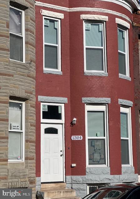 Price reduced !!!!This newly renovated brick row home features three (3) bedrooms and one full bathroom, one half bath on main level , located in the Oliver neighborhood. The home boasts a modern, neutral gray theme with luxury vinyl plank flooring. The main level includes a spacious front living room with a separate room for dining, while the kitchen has granite counters and hosts the washer/dryer combo. A door from the kitchen leads out to the rear. Upstairs are the three (3) bedrooms. The full bathroom on this level is updated with a tile tub-shower and a window for natural light. Downstairs, the partially finished lower level provides ample storage space and a separate bonus room with a window that can be used for a family room or home office. Step outside to enjoy the fully fenced rear yard, a great spot to relax or entertain. Whether you are looking for a primary residence or an investment opportunity to rent, this move-in ready home has it all.