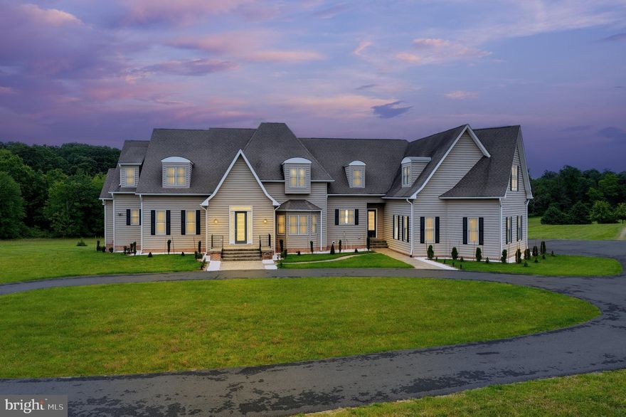 🔥MOTIVATED SELLERS... IMPROVED PRICE! - Rare flat, open and useable 26.59-Acre Loudoun Estate!
Discover Longmoor Farm, where estate living meets modern elegance—your chance to own a private Loudoun retreat of luxury, serenity, and endless possibilities.
<br><br>
Your private escape awaits at Longmoor Farm Estates—an extraordinary 26.59-acre retreat in Hillsboro/Purcellville, VA blending luxury, scenic serenity, and wide-open possibilities. Whether you're envisioning a multigenerational farm, a boutique vineyard, wedding venue, or a peaceful equestrian haven, this estate is your canvas for bold dreams.
<br><br>
As you approach via a grand circular driveway, the stately custom residence stands proudly, framed by meticulously landscaped grounds and sweeping countryside views. Inside, over 8,600 square feet of soaring ceilings, rich Brazilian teak hardwood floors, elegant millwork and tons of storage deliver the ultimate statement of refinement and comfort.
<br><br>
🌟 Gourmet chef’s kitchen with premium stainless steel appliances and expansive cabinetry
🔥 Stone gas fireplace anchors the sun-drenched family room with panoramic views
📚 Custom study/library with built-ins and Verizon/Xfinity and other high-speed internet providers available—ideal for work or school
🛌 Main level primary suite offers a sitting area, veranda access and a spa-inspired bath and his & her oversized walk-in closet
🎬 Upper-level 2nd primary or media room with luxury paneling, walk in closet and bath
🍸 Fully finished walkout basement featuring a second kitchen, billiards room, custom bar, gym/flex bedroom + full bath
<br><br>
Bring the whole crew—family and guests alike will love the space and privacy, including a chic attached 2 room + full bath apartment with separate entrance, perfect for au pairs or farm sitters.
<br><br>
Outside, the lifestyle continues with:
🐎 4-stall barn with tack room, paddock, well water pump and riding ring for your horses or hobby farm
🚜Huge auto garage with high double bay, tractor storage – perfect for car repair, machine shop, farm business or toy storage
🌳 Level, usable land with creek on underground springs, well water, ready for a pool, garden, vineyard or crops (currently cut hay for tax credits)
🛡️ No HOA, 3-board blackboard fencing, and peace-of-mind upgrades: 18k generator, new appliances, new paint and carpet, new epoxy garage floor, updated landscaping, and more!
<br><br>
All just minutes to the charming towns of Hillsboro, Roundhill and Purcellville, with top-rated Loudoun County schools (Mt. View ES, Harmony MS, Woodgrove HS).
<br><br>
Your dream estate is move-in ready and waiting.
Schedule your private tour today and enjoy the country and all farm living has to offer.