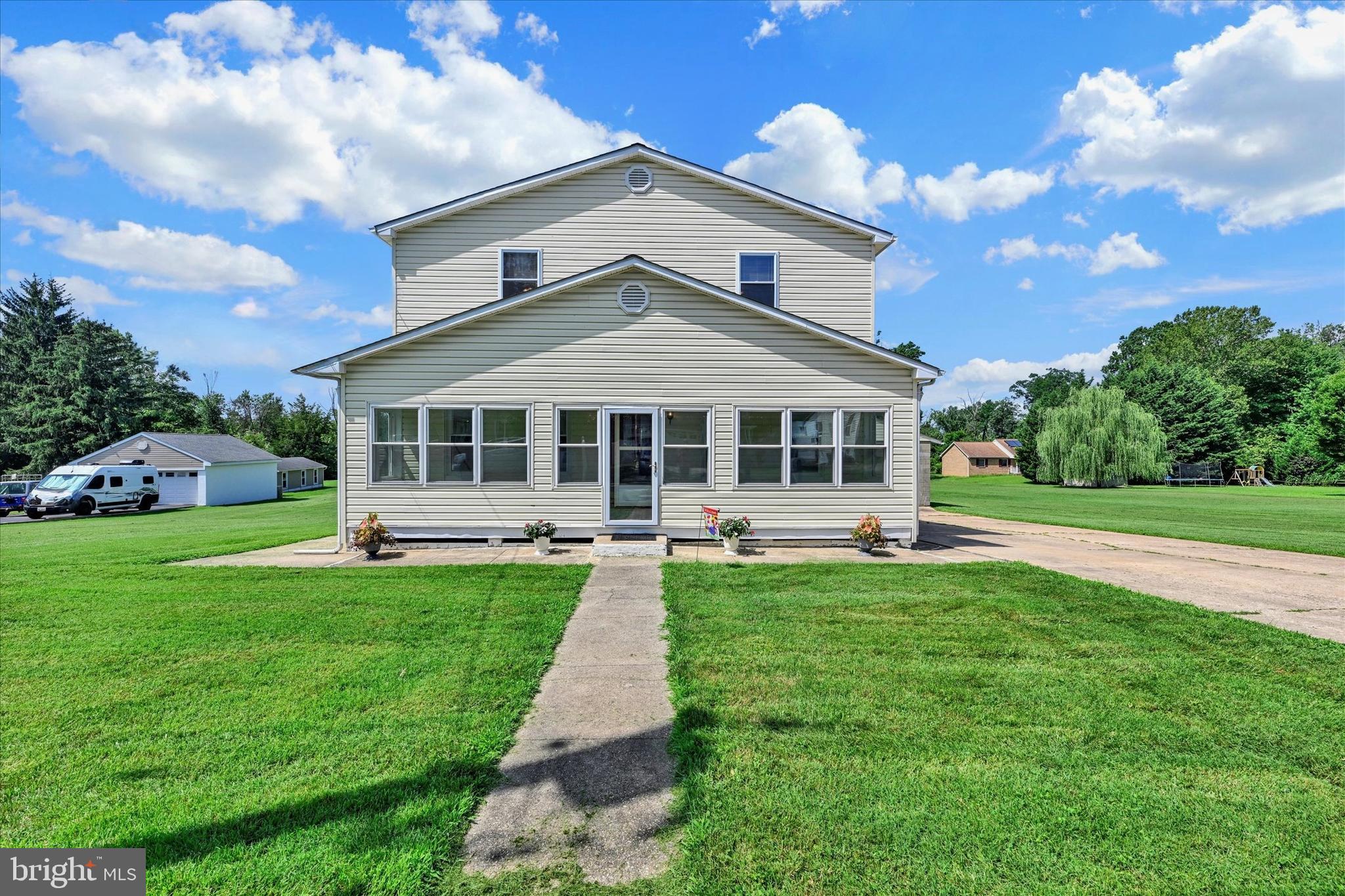 This landmark Rosedale Heights home is available for the first time in 60 years. Lovingly improved and maintained over the years, this 4 bedroom, 2 full bath home boasts roughly 3,000 square feet of living space on a 3+ acre lot that backs to Redhouse Creek. First floor highlights include high ceilings, a light filled living room, formal dining room, kitchen and entry level bedroom with connecting bath and laundry hookup. Upstairs, you’ll find three spacious bedrooms with large closets and another full bath. Outside, the detached oversized garage (complete with electricity) is the perfect annex for the car enthusiast who needs enclosed space for work, hobbies or storage. Adjacent to the garage is a large sunroom/enclosed bonus room that would make the perfect space for entertaining, a game room, man cave/she shed or office. The possibilities of this property are endless with room for expansion, multigenerational living, and homesteading in addition to possible subdivision (buyer to verify possibility with county). The buyers will greatly benefit from the investments made by the current owners, including: New roof (2019), water heater (2020), A/C (2022) and oil tank (2023). There is additional square footage in the waterproofed basement as well as a large detached storage shed. Convenient location with easy access to 695, I-95, shopping and restaurants. Schedule your showing today so you don't miss out on this lovely home!