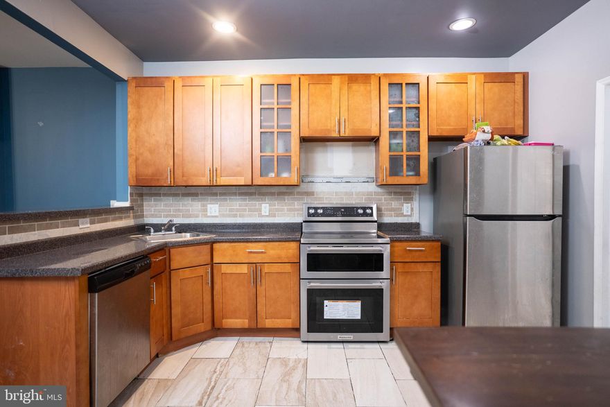 Welcome to this spacious and versatile 4 bedroom, 2.5 bath home, perfect for homeowners and savvy investors alike. This well-maintained property features a bright and open layout, highlighted by a modern kitchen with ample cabinet space, stainless steel appliances, and a convenient breakfast bar that flows seamlessly into the dining area.

The home offers generous living space, including a finished basement with an additional private room that can be used as a home office, bedroom, or flex space to fit your needs. Upstairs, enjoy access to a private second-floor balcony—perfect for relaxing or entertaining. Additional features include central A/C, a newer roof, updated plumbing, and the convenience of an included washer and dryer.

Zoned RM1, this property presents a unique opportunity to convert into a two-family dwelling, making it ideal for house hacking or long-term investment potential.
Don’t miss your chance to own a property that offers both comfort and future upside.  Seller concessions considered with competitive offers!