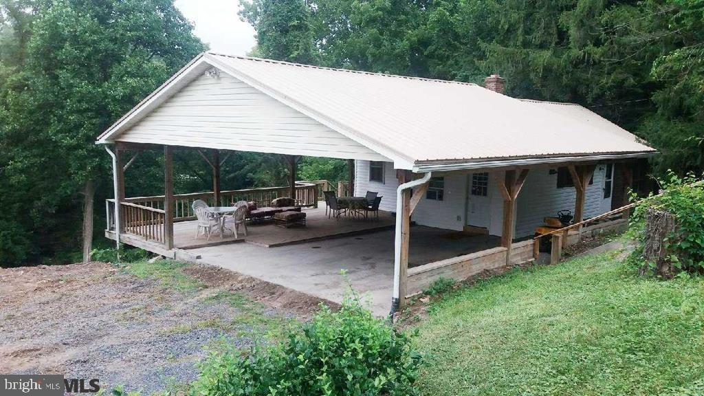 Cute ranch in Strodes Mills- w/large attached carport. Enjoy relaxing on the nice covered deck overlooking the stream at the rear of the property. Recently remodeled- move-in ready! Serene country setting in a desirable location. Call now to see inside!