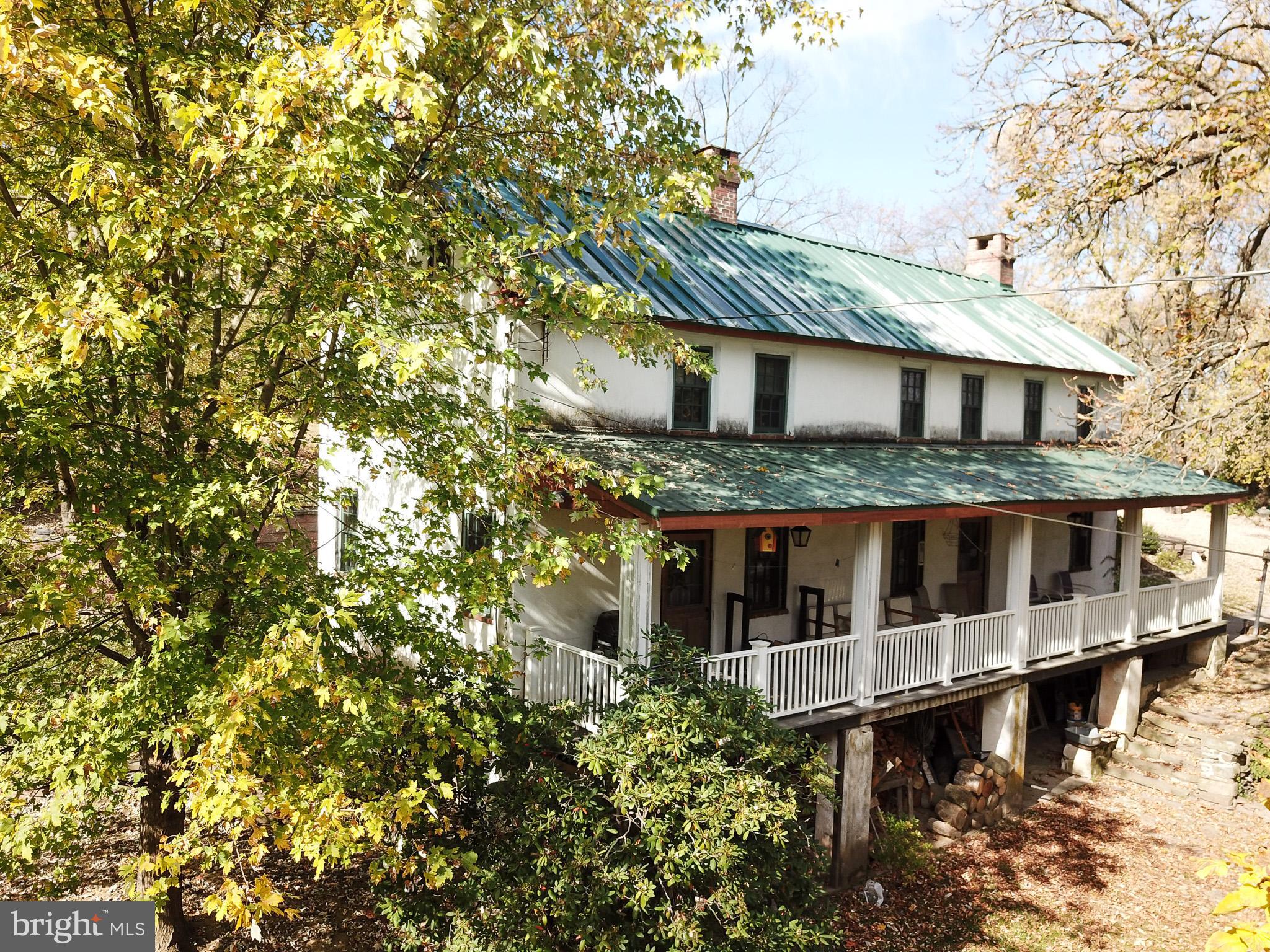 Serene Farmhouse in a bucolic 3.5-acre setting. You've been waiting for a historical charmer on some ground that's modern enough for your gang, but offers the opportunity to make it your own. The extensive landscaping features a skilled gardener's selection of plantings, perennials, and trees. Southern facing gently sloped fertile soil promises a knock-out veggie garden you've always said is a must-have. This home is a gorgeous historic Pennsylvania Architectural brick with a sprawling front porch over a stone foundation. Lovingly upgraded and updated, the heart of the house is a fantastic eat-in kitchen with modern appliances, which opens to the extremely private back patio. Unique wide plank flooring from a bygone era. Contrast the history with most modern concepts like high-efficiency wall-hung gas hot water and central Air. 121 Metka is a hard-to-find and stunning little farmette awaiting new owners who desire to surround their lives in a setting that supports animals and kids and is big enough for everyone's dream and vision of home. A stone's throw to Limerick Community Park, a remarkable 70 Acre treasure featuring two pavilions, 3 softball fields, two little league fields, a baseball field, two sand volleyball courts, two basketball courts, two restroom facilities, and a 1.1-mile paved walking/running track with 12 fitness stations. Wow! Within the excellent Spring-Ford school system and a bus stop at your driveway. You would be right to guess that this type of forever home is rare.