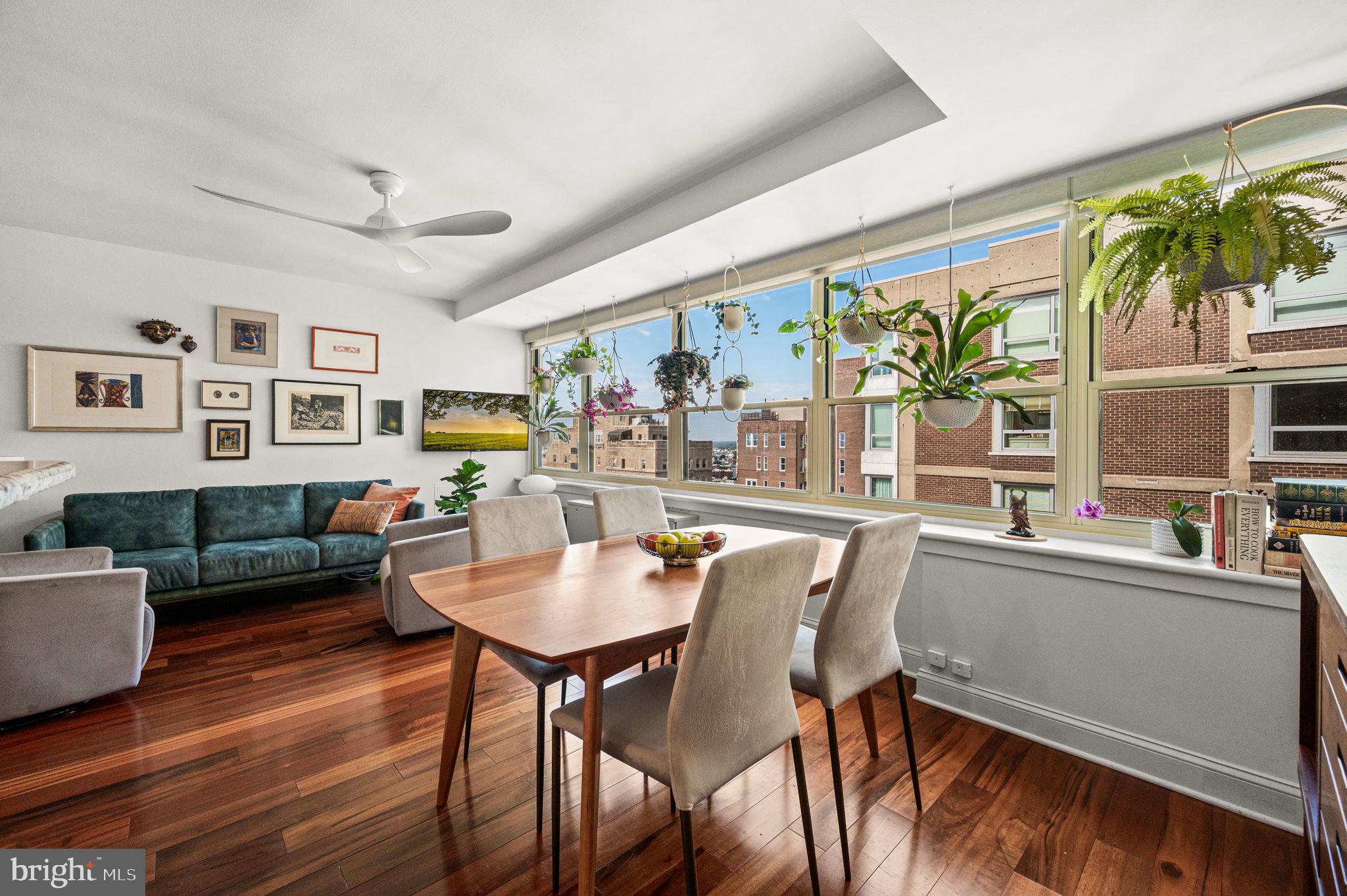 Views for Miles & Sunsets to Swoon Over! Perched high above iconic Rittenhouse Square in the mid-century-modern Savoy, this rare combined unit with 2 bedrooms, 2 full baths has charm and convenience, with stunning southern views all the way to the stadiums.Warm wood floors set the perfect stage for modern city living. The open kitchen boasts granite countertops and new stainless-steel appliances (oven excluded), looking onto the spacious living/dining area. The incredibly generous primary bedroom suite offers a true retreat with a sitting area, walk-in closet, additional closet, and a Miele washer/dryer tucked neatly inside. Custom shades were added throughout the home, including blackout shades in the primary bedroom. Ceiling fans are in both bedrooms as well as the main living space. Storage is abundant, with a total of seven closets, including two walk-ins (one in each bedroom) PLUS two basement storage units (3x3x3).Life at the Savoy is as vibrant as its Rittenhouse Square setting. Step out the front door to twice-weekly farmers markets and pop-up performances. Enjoy fine art and craft fairs, theaters, concerts, restaurants, and shopping. The building’s mid-century construction is celebrated for its privacy, complemented by a 24/7 front desk person, and extremely responsive maintenance staff. The Savoy is being thoughtfully updated, with newly renovated hallways complete and an exciting first-floor refresh in the planning stages. One of the city’s top boutique architecture studios is designing the lobby, gym, conference room, and mailboxes, all with no assessment to residents. The condo fee is all-inclusive, covering all utilities plus composting pickup (optional) and trash/recycling on every floor. Residents also enjoy access to the gym for a nominal fee. To top it off, the roof deck provides panoramic views of the city from the Ben Franklin Bridge to UPenn. Multiple bus lines on Walnut and Chestnut Street make commuting a breeze. This home delivers the perfect blend of space, style, and unparalleled views, a true front-row seat to the very best of city life.