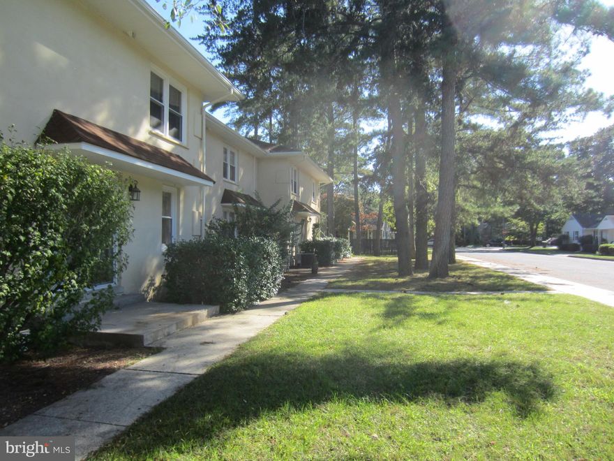 Two-story apartment available now. Located in the Spanish-style buildings on the corner of South Boulevard and Logan Street, near Salisbury University and Tidal Health. The first floor has a living room, dining area, kitchen, and half-bath. The second floor has two bedrooms, a full bathroom, linen closet, and laundry. Updated kitchen with new cabinets, counters, and appliances, plus brand new carpet and fresh paint throughout. Appliances include electric range, refrigerator, built-in microwave, dishwasher, washer, and dryer. Electric heat-pump and central air. Resident parking is in the attached lot. Tenant is responsible for electric, Landlord pays for water/sewer/trash. Available now.     MINIMUM APPROVAL REQUIREMENTS: Good rental history, net income 3x rent (or housing voucher), credit score 600, and 7 year criminal background check.