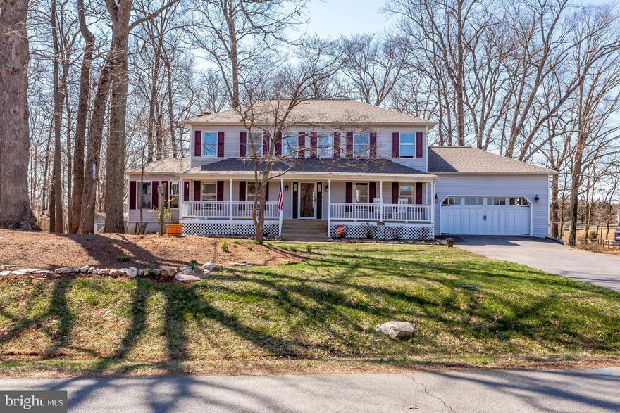 This completely updated colonial sits on private 1+ acre lot with serene equestrian views and sunsets.  It's stunning open kitchen has quartz counter tops, stainless steel appliances, custom cabinetry, and is immediately open to the spacious family room with fire place, large windows, high ceilings and skylights. Main level has formal dining room, family room, living room, and office.  Upgraded light fixtures and recessed lighting throughout. Upper level has 4 bedrooms and 2 full bathrooms.  The luxury master bathroom has separate vanities, upgraded shower with frameless doors and designer flooring - its the ultimate retreat! Lower level has finished walk-out basement with large recreation room, den/work out room/flex space as well as a 3rd full bathroom.  Enjoy the backyard views on large deck overlooking the horses/pasture. This home has all of the upgrades you desire...it's a MUST SEE!