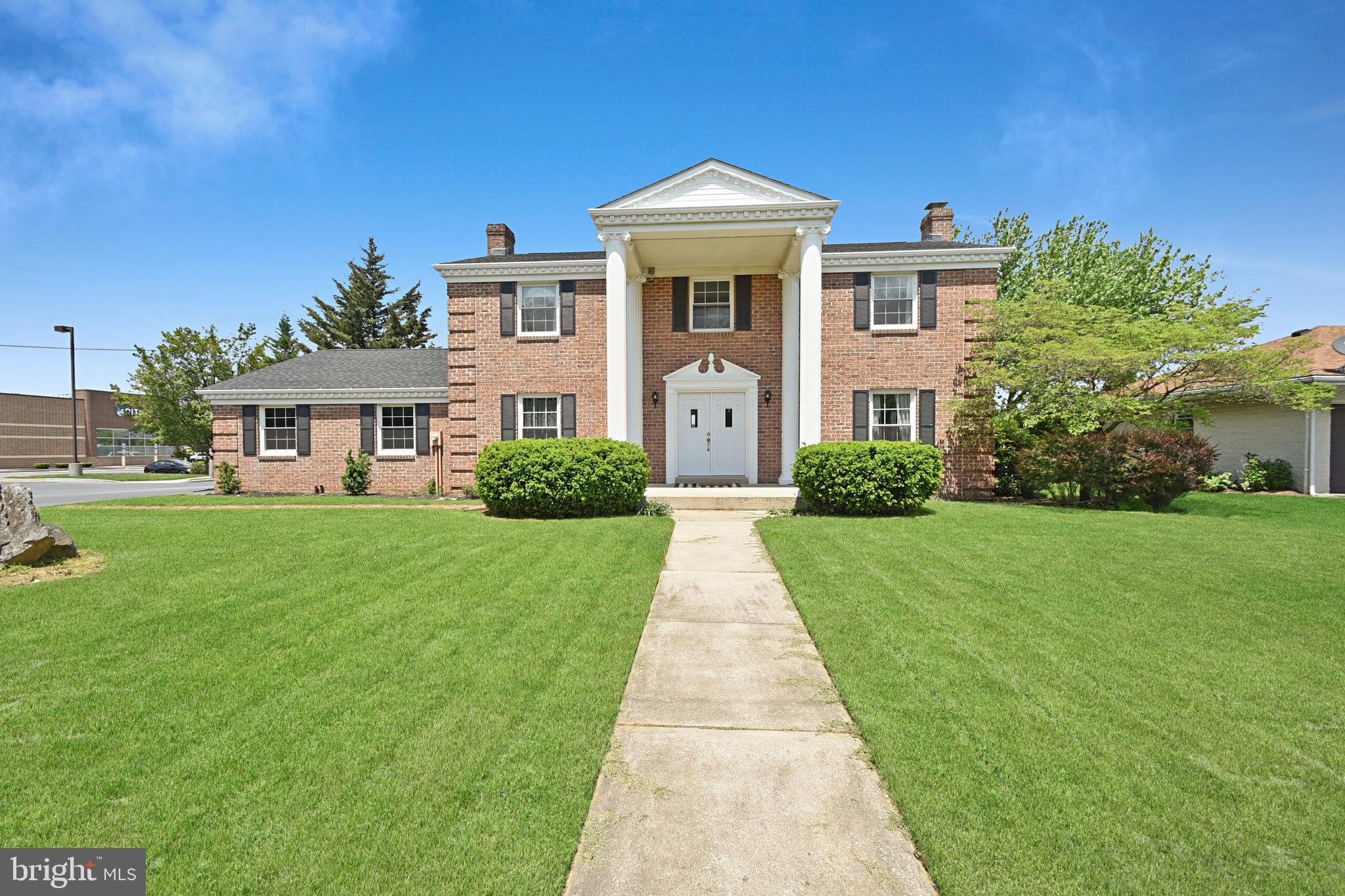 Completely updated 4 bedroom, 2.5 bath brick Colonial home with a 2-car garage. This move-in ready home features a fully remodeled kitchen with the newer granite countertops, tile backsplash, stainless steel appliances, updated cabinets, sink, and faucet. The main level offers a spacious living room, formal dining room, dedicated office, and a half bath, all with updated light fixtures and newer paint. Upstairs you'll find a primary suite with plush newer carpet and an en suite bath with double vanities. The huge finished basement with brand new luxury vinyl plank flooring (2024) is ideal for a family room, den, or game space. Major updates in 2019 include a new roof, all new windows, new front and rear patio doors, new HVAC system, new heat pump, new flooring throughout, all new kitchen and bath fixtures, new toilets, a new paved driveway, new landscaping, new concrete rear patio, and a new overhead garage door. New hot water heater in 2023. Set on a gracious lot with mature landscaping, this home is more than move-in ready—it’s a rare opportunity to own a property where classic design meets modern clarity.