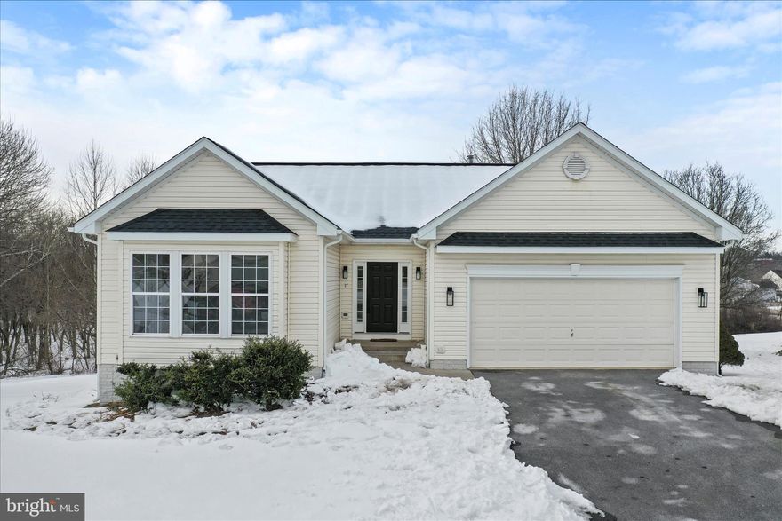Welcome to 17 Hook Drive in Martinsburg, WV—a beautifully updated home that combines modern finishes with a peaceful wooded setting and quiet cul de sac. This move-in-ready property just had a major renovation in 2026, making it better than new. Enjoy peace of mind knowing that new HVAC system and  roof will serve you for many years to come. Freshly painted throughout with stunning new LVP flooring , along with fully renovated bathrooms and an open floor plan make this home shine. The kitchen has been updated with new quartz countertops and stainless steel appliances, with space for your kitchen table. Enjoy cozy evenings by one of two fireplaces, or relax while taking in the serene wooded views on your screened in porch. The finished walkout lower level is large for however you need it to function with plenty of unfinished storage space and a full bath. Located in the desirable community of Stonebridge  offering a community pool. This home is also convenient to shopping, dining, and Routes 81 and 9, making commuting a breeze. Stylish, comfortable, and ideally located—this one checks all the boxes. Why wait for new construction when you can have a new home in an established neighborhood with a large lot! Call or text today for your private tour.