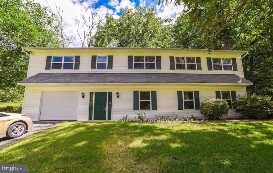 Beautifully renovated home. Hardwood floors in Living Rm, Dining Rm, 3 Bedrooms & Hall. Eat-in Kitchen with plenty of counter & cabinet space and new tiling. Eating area opens to Patio. Lower level front door enters into gracious foyer. Bright Family Rm with fireplace &new floor. Large Office/ Study also has new floor. Extra long garage+storage area. Near Tennis Court,Pool&Park.