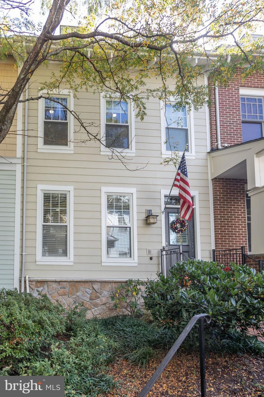 Timelessly and thoughtfully renovated from top to bottom, this Clarendon Park townhome is a rarity and a must-see! The floorplan of the main level is fully opened, allowing light to spill through the unit and across the gleaming hardwoods, enhancing the function of the lovely living room, gracious dining room and the expansive chef's kitchen.  The rear of the home is fully devoted to the luxurious kitchen.  Both peninsula and island space provide convenient quartz countertop prep and entertainment space.  The island boasts casual breakfast-style seating spaces.  A wall of storage cabinets, both closed and glass-fronted, provide an abundance of practical yet pretty storage/pantry space.  The Wolf range, natural stone-textured backsplash and putty-colored timeless cabinetry really elevate the space to the next level.  Through the sliding glass door, you'll access a lovely seating space/grilling balcony for the perfect fall mornings and evenings.  Heading to the bedroom level, the renovations continue.  Hardwood flooring extends throughout this floor, including in the light-filled primary suite.  The primary bath has been fully renovated to include a lovely dual-basin vanity, a large, practical linen closet and a stunning shower with frameless glass enclosure.  The second bedroom has been used as a dressing room and the closet system remains in place, should this function be practical for you.  However, the Seller is prepared to remove the system and repair/repaint, bringing its purpose back to a lovely second bedroom.  The hall bath was beautifully renovated to maximize its practicality.  The tilework and countertops are timeless and elegant.  The deep soaking tub is enclosed by a frameless glass shower door.  The laundry is located on this floor- side-by-side full size units.  Heading to the loft level, an additional bed and bath await.  The space is cozy and carpeted with dramatic vaulted ceilings.  The loft-level bathroom has been fully updated as well.  Through this lovely bed/lounge space, you'll access the rooftop terrace.  The lower level of this home is a fabulous bonus space, large enough for the purpose of your choice- office, exercise room, play area...you name it.  The space has a built-in and hardwood floors that lend to its versatility.  Full list of upgrades/updates to come in the documents section.