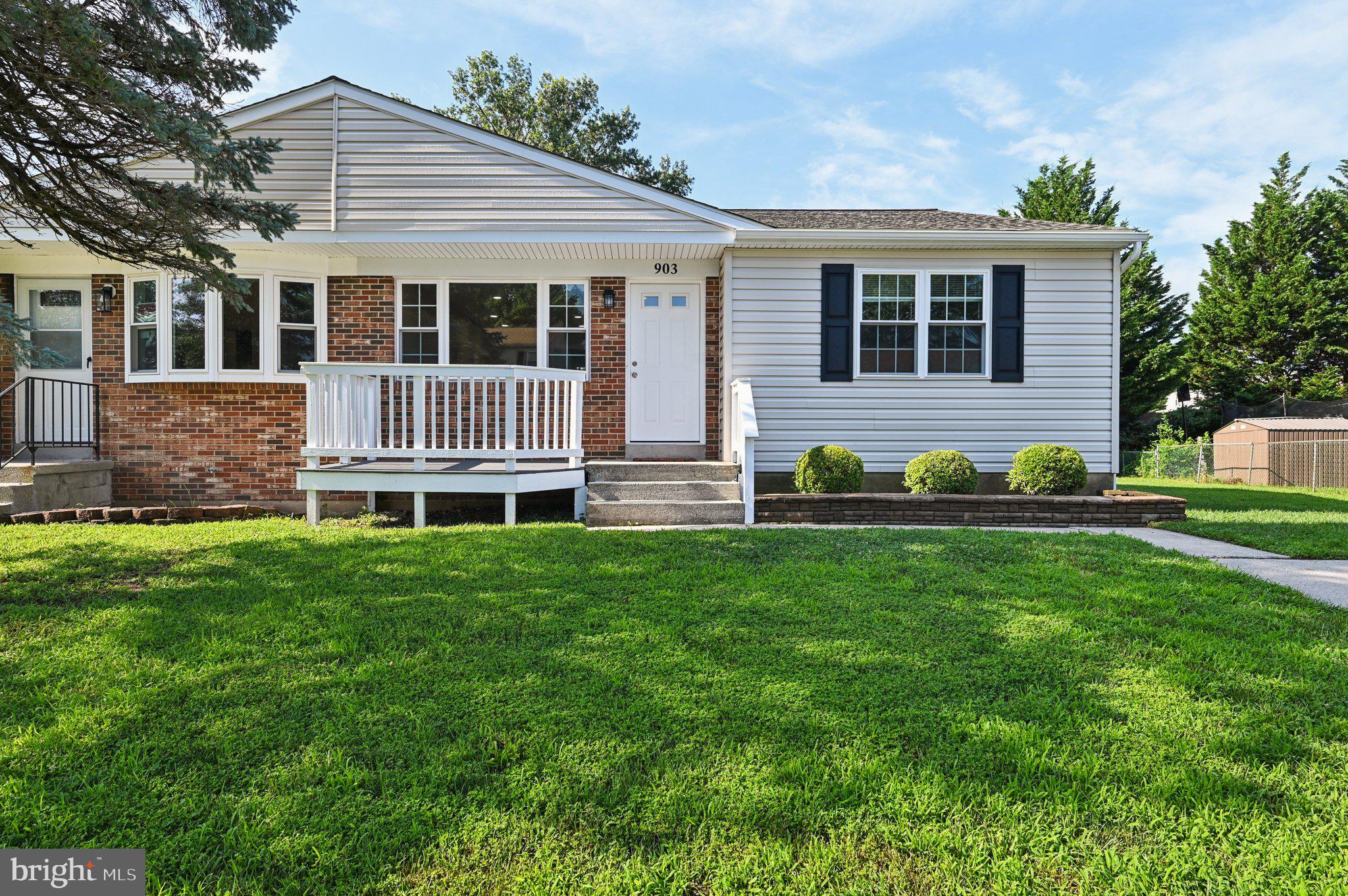 Welcome to this tastefully updated duplex in Turf Valley, situated on an oversized lot with mature Leyland cypress trees providing natural screening and privacy, creating an ideal setting with plenty of space for outdoor entertaining. A two car driveway offers convenient off‑street parking, while the inviting front porch—spacious enough for rocking chairs—sets a warm and welcoming tone. Inside, hardwood floors extend throughout the main living area, where a brand new picture window, framed by two operable windows on each side floods the space with natural light. The open layout flows seamlessly into the kitchen, which overlooks the backyard landscape and features recessed lighting, a kitchen bar with stylish pendant lights, extra cabinetry for storage, a generously sized pantry, and large sliding window overlooking the backyard landscape. Enjoy the convenience of single‑level living, with the kitchen and living room situated alongside three comfortable bedrooms, all featuring brand‑new carpeting that also extends through the hallway. This level also includes a beautifully remodeled full bath with a newer vanity and updated lighting, while the owner’s suite offers the added convenience of a private half bath. Adding an abundance of added space, the finished lower level continues the updates with fresh carpeting throughout, a convenient full bath with a shower, and laundry room. There’s also an exit door to the backyard and two small operable windows that bring in light and ventilation. Recent updates include new roof just two months ago, along with new windows, toilets, attic insulation, recessed lighting in dining and living areas, and bedroom doors. Conveniently located close to shopping, restaurants, and major commuter routes including Ritchie Hwy., Rt. 100, and Rt. 97.”