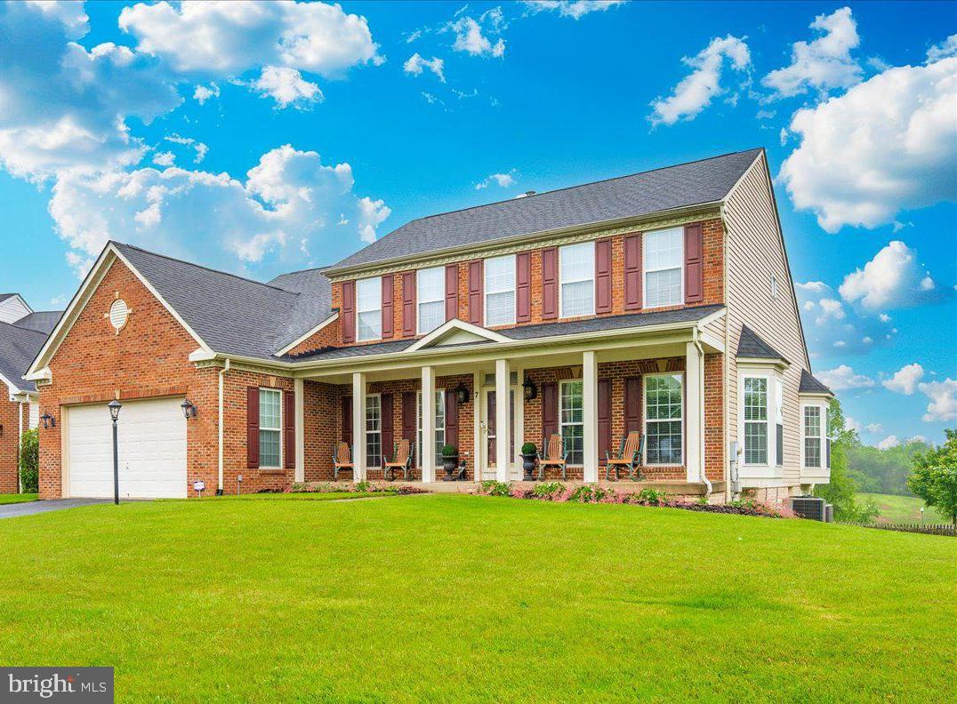 WELCOME HOME! Lovely Brick Front Colonial in highly sought after Galyn Manor! Located on a cul-de-sac. This highly upgraded home has been meticulously maintained by it's original owner. The large, covered front porch leads into the two-story foyer with gleaming hardwood floors. The home boasts a chef's dream kitchen with cherry cabinets, new granite countertops, double oven, gas cooking, double sink, new dishwasher and breakfast bar. There is an expansive eat-in area that leads onto the added oversized screened deck that features a knotty pine cathedral ceiling. Great room off of kitchen area features two-story ceiling. Main level primary bedroom with 2 walk-in closets. The primary ensuite bathroom features two vanities, walk-in shower and a soaking tub. Main level laundry. Main level powder room. Dining room with bump out. Formal living room. Upper level features a 2nd primary suite with ensuite full bath. Bedroom 3 and 4 are also on the upper level with a hall, full bath. The lower level would be perfect for an in-law or guest suite as it features a kitchenette, a hobby room, full bath and large recreation room that leads out to the lower level patio. There is an enclosed shed built under the deck with concrete flooring. Hunter blinds on windows. Central vacuum. This is the cream of the crop! Close to schools, shopping and restaurants. MARC train nearby. Great commuter location!