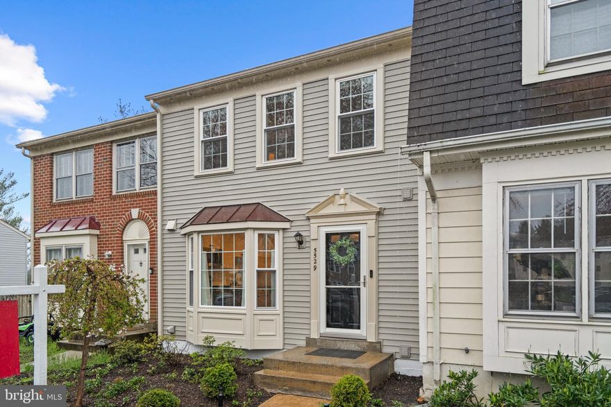 Come fall in love!  This captivating home features gleaming hardwood floors throughout the main level.  Lovely eat-in kitchen adorned with a beautiful bay window.  It’s a chef delight equipped with quartz countertops, stainless steel appliances, soft-close cabinets, and a pantry.  The dining area flows into the living space, creating the perfect open floor plan feel.  Upstairs, you'll find spacious bedrooms including a sunlit primary bedroom with an en suite bathroom.  The second bedroom is incredibly spacious with hardwood floors and two closets, easily convertible into two rooms if you need an extra bedroom.  The hall bath has been recently updated. Lots of natural light fills the fully finished basement, which offers ample space and a cozy wood-burning fireplace, along with a powder room.  The laundry room on the lower level features a new washer/dryer and plenty of storage.  Step outside to the fully fenced backyard with a gorgeous new patio, perfect for relaxing or entertaining.  This home comes with two parking spaces right in front.  Plenty of visitor spaces in the community and street parking available for your guests.  It is conveniently located near major commuter routes, including Roberts Pkwy, Fairfax County Pkwy, Rt. 123, Braddock Rd, Guinea Rd, and I-495.  Conveniently located near parks, walking trails, shops, GMU, the VRE, and so much more!  Recent updates include new Kitchen in 2023, new Windows in 2023, all new Bathrooms in 2022, new Patio in 2021, new Roof in 2020, new Siding in 2020, newer HVAC system in 2019, and newer Water Heater in 2018.  Don't miss out on this exceptional home that offers both comfort and convenience. Schedule your showing today!