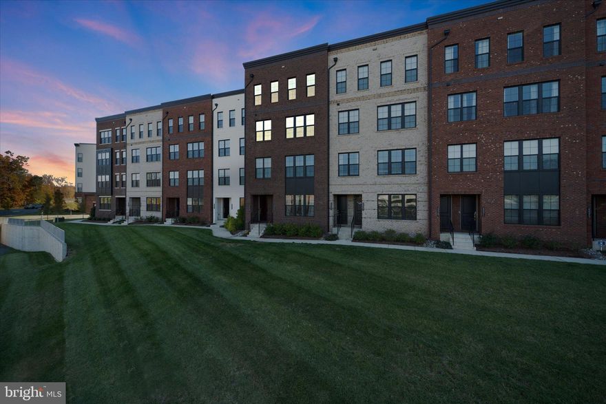 Welcome to this stunning 3-years young 2,662 sq. ft., 3-bedroom, 2.5-bath, one car garage home with a private office on the main level! The luxurious owner’s suite features a spacious bedroom, a spa-inspired en suite bath, and a custom-designed walk-in closet that adds both function and style.

Entertain family and friends with ease in the open-concept main level, where expansive windows bring in natural light and offer beautiful pond and tree views. This level showcases a thoughtfully designed kitchen with a large center island and breakfast bar, a generous walk-in pantry, quartz countertops, stainless steel appliances, and stylish LVP flooring.

A private office on the main level provides the perfect space to work from home, while the covered deck and private rooftop terrace offer the ideal spots to unwind and relax after a long day.

Enjoy a low-maintenance lifestyle, with snow removal, lawn care, and exterior upkeep all included through the association. The community features exceptional amenities including a spacious clubhouse, resort-style outdoor swimming pool, modern fitness center, scenic walking and biking trails, and tot lots.

Commuting is a breeze — the Silver Line Ashburn Metro Station is just a 5-minute walk away, and the community offers easy access to Route 7, Route 28, and the Dulles Toll Road.

Loudoun County provides the perfect balance of convenience and lifestyle with cultural attractions, beautiful parks, local wineries and breweries and year-round community events. In addition to highly rated schools, the neighborhood is just minutes from upscale shopping, fine dining, and a variety of international grocery stores adding to the area’s vibrant and convenient lifestyle.  Loudoun County living at its best--stylish, convenient, & connected!